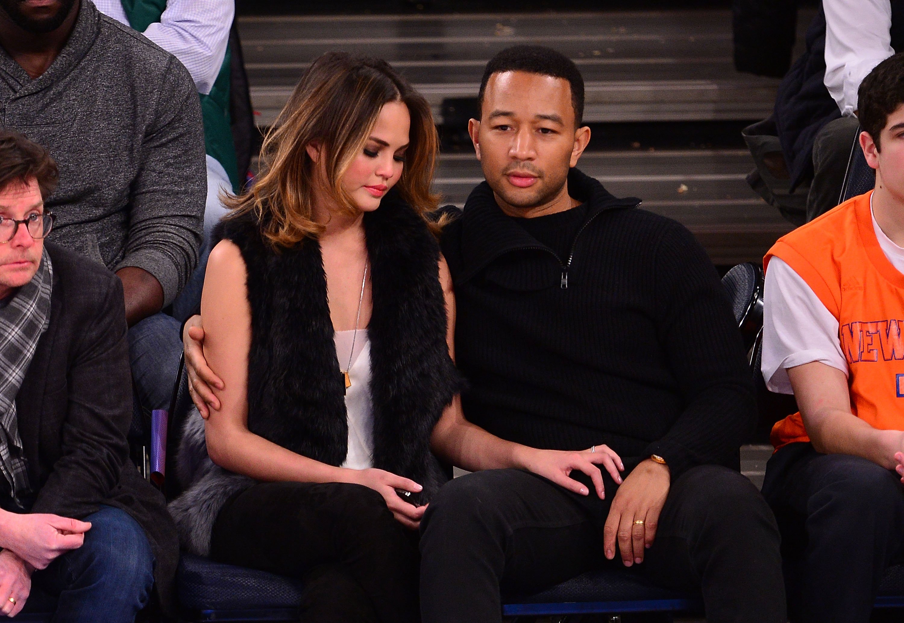 Christine Teigen and John Legend attend the Brooklyn Nets vs New York Knicks game at Madison Square Garden on January 20, 2014 in New York City | Source: Getty Images 