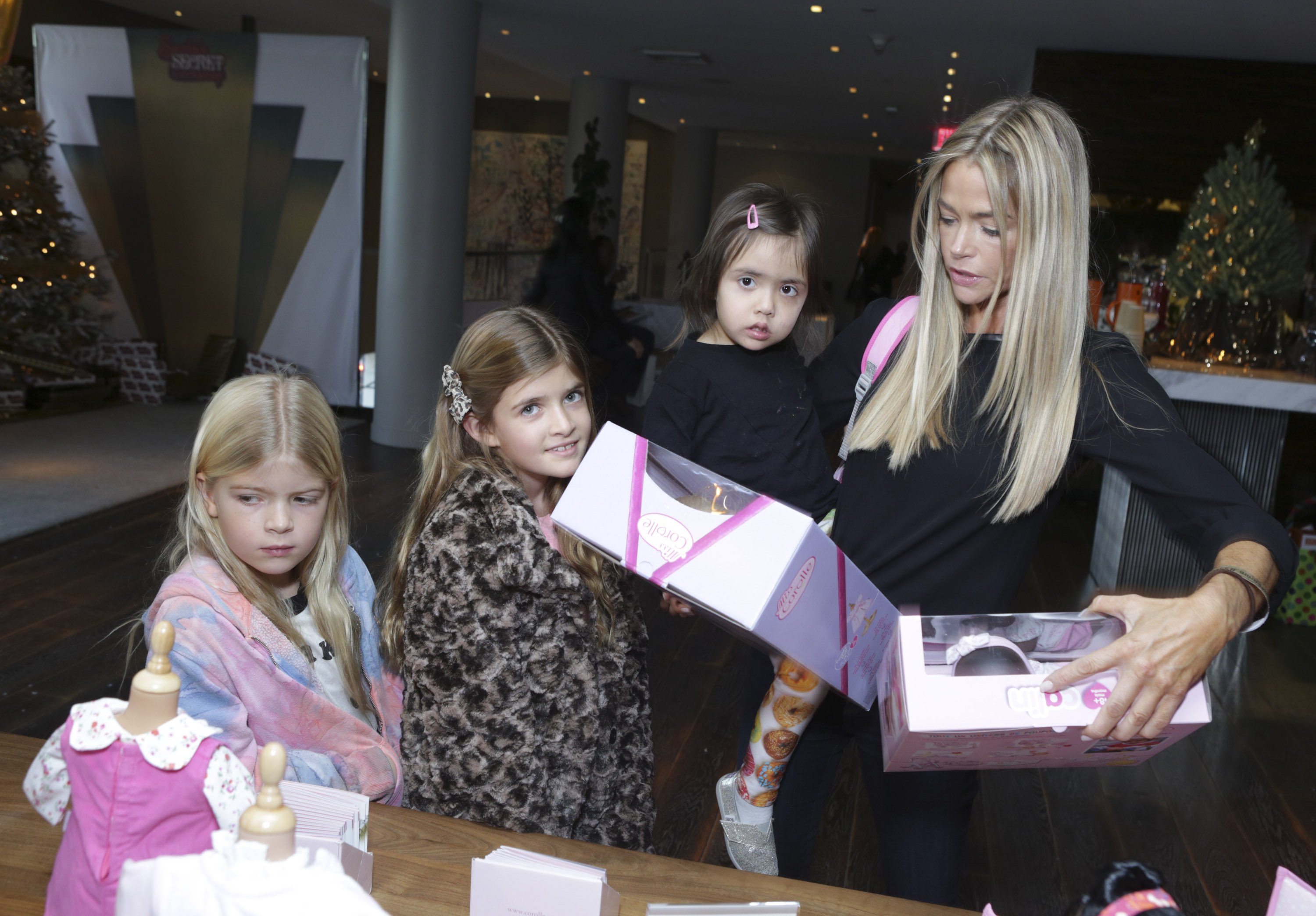 Denise Richards, Eloise Richards, Lola Sheen and Sam Sheen attend the 3rd Annual Santa's Secret Workshop Benefiting LA Family Housing at Andaz Hotel on December 7, 2013 in Los Angeles, California. | Source: Getty Images