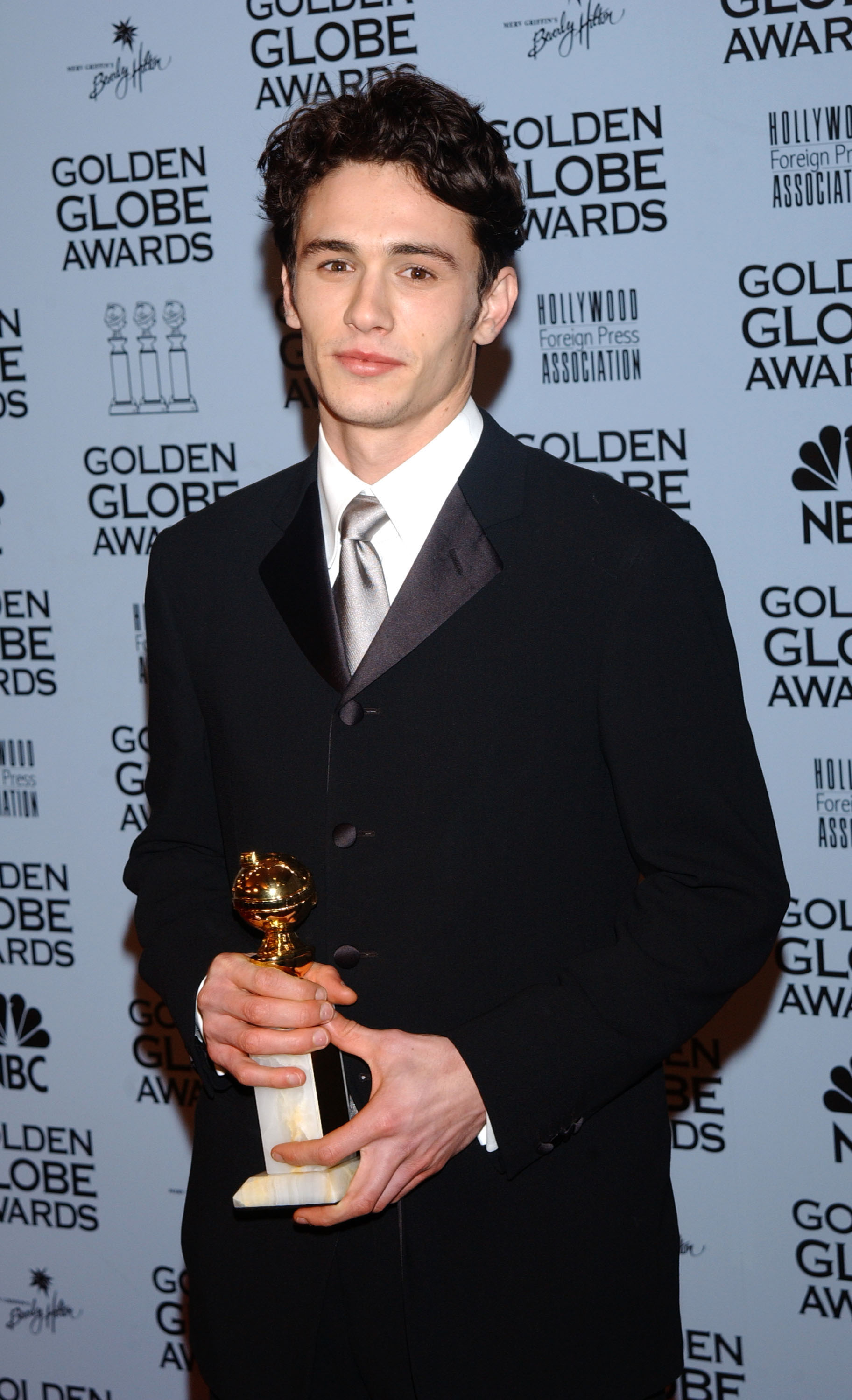 Dave Franco poses in the press room with his Golden Globe for "James Dean," recognized for Best Actor in a Miniseries or TV Movie. The win marked a turning point in his dramatic acting career.