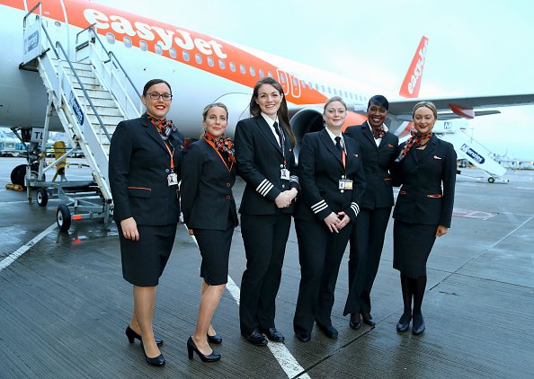 Crew of  an EasyJet flight posing in front of a plane at Gatwick Airport | Photo: Getty Images