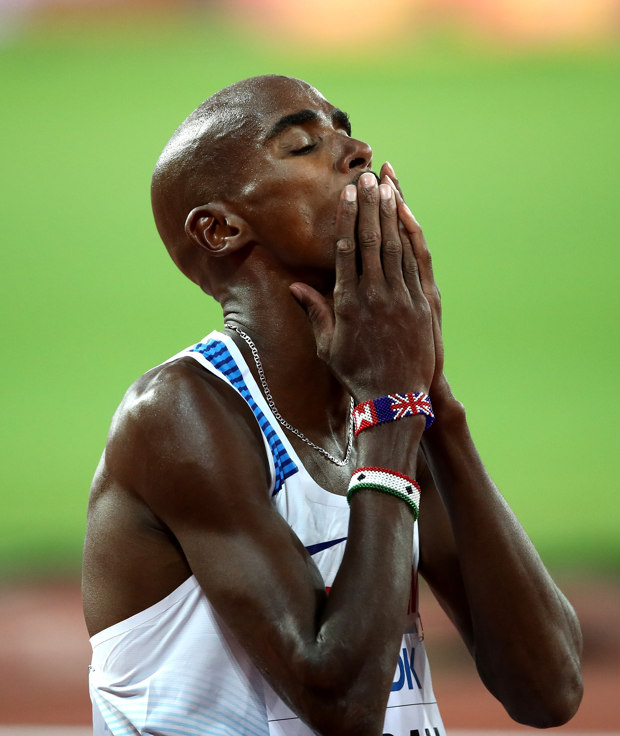 Sir Mo Farah closes his eyes and presses his hands to his lips after crossing the finish line in second place in the Men's 5,000 Metres final at the 16th IAAF World Athletics Championships, held at London Stadium on 12 August 2017. It was a rare silver for a man so accustomed to gold, yet the emotion on his face told a story far larger than any single race.