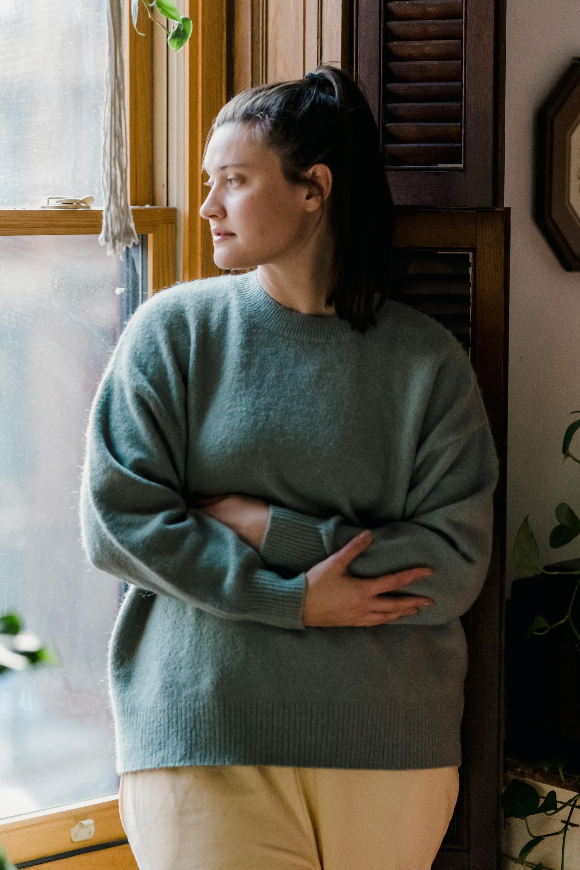 A thoughtful woman looking out the window | Source: Pexels