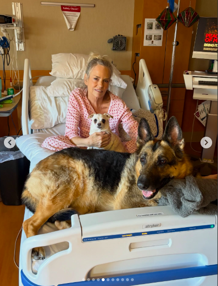 Jennifer Runyon smiling as she spends time with dogs from a hospital bed. | Source: Instagram/bayleycorman