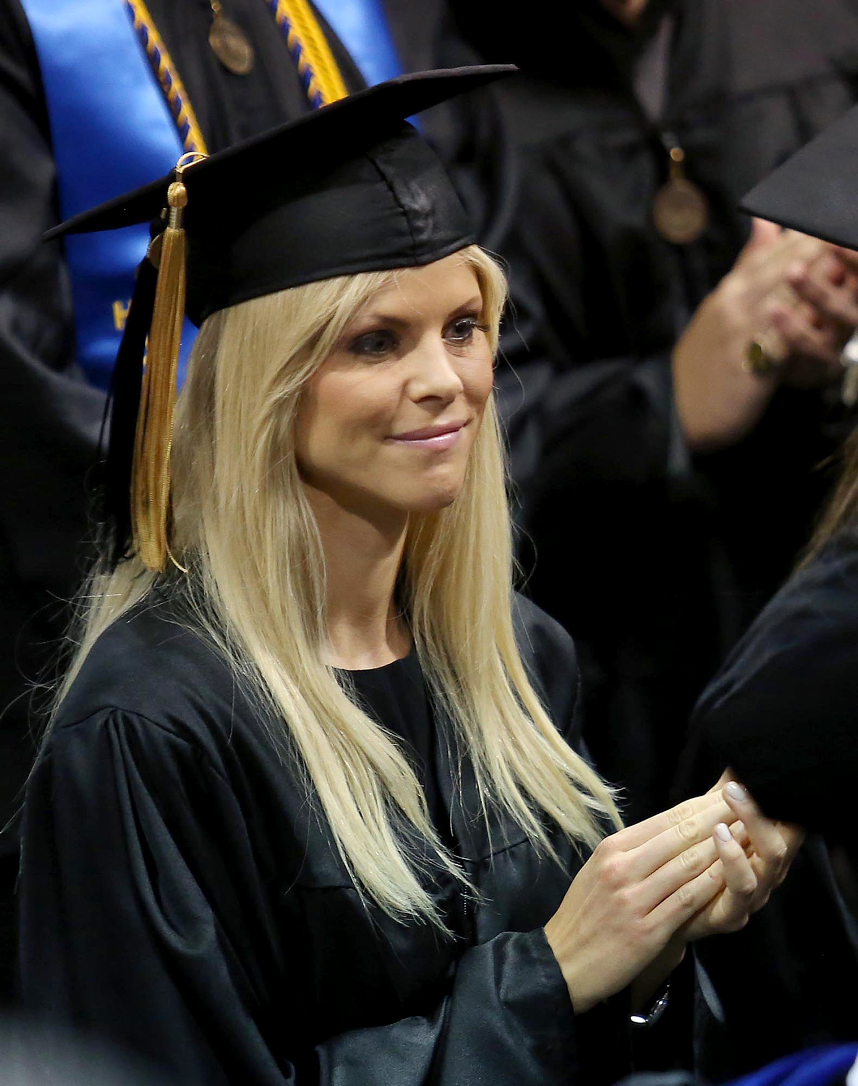 Elin Nordegren claps during commencement ceremonies at Rollins College in Winter Park, Florida on May 10, 2014 | Source: Getty Images