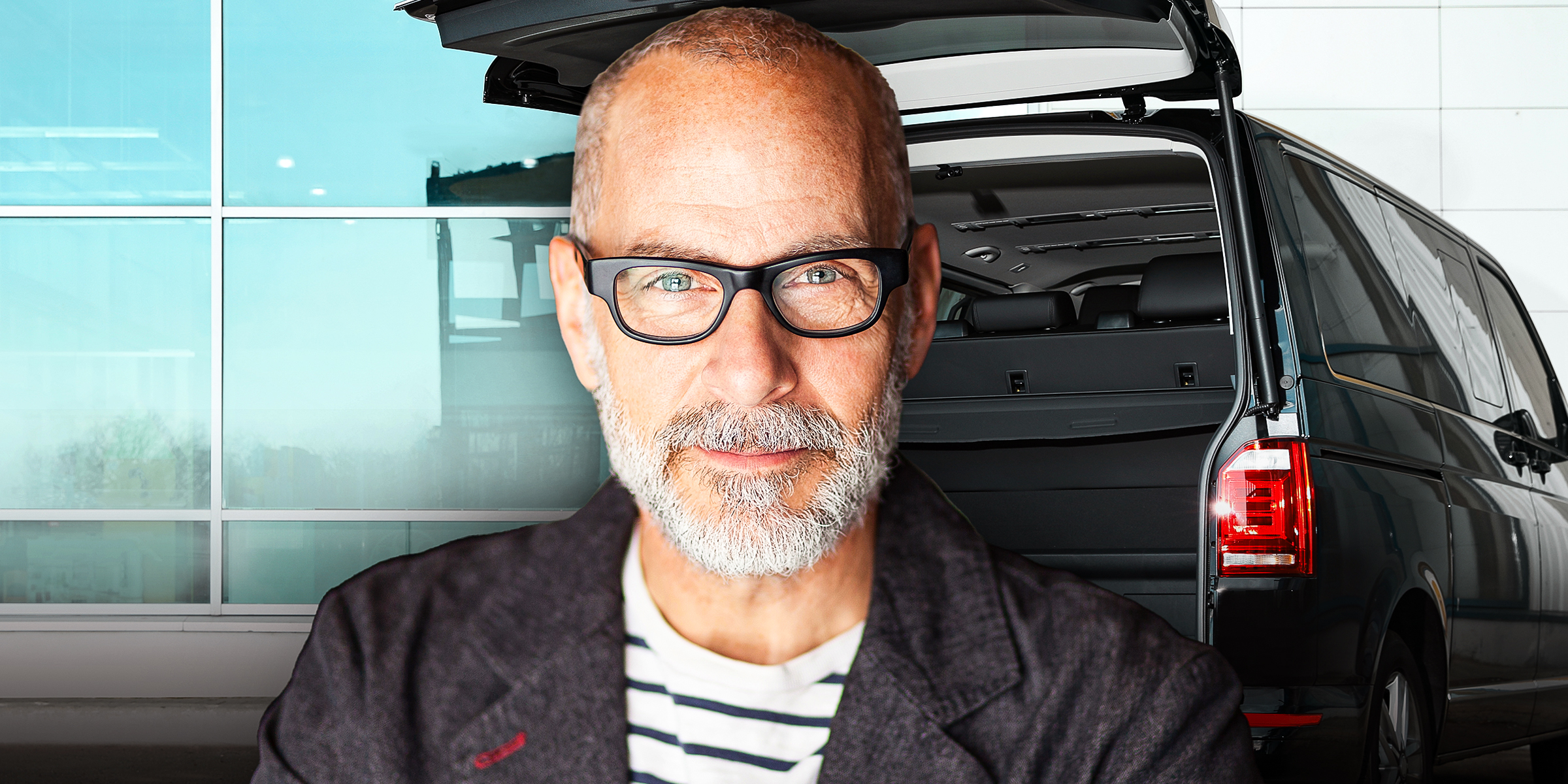 A smiling older man with an open car truck | Source: Shutterstock