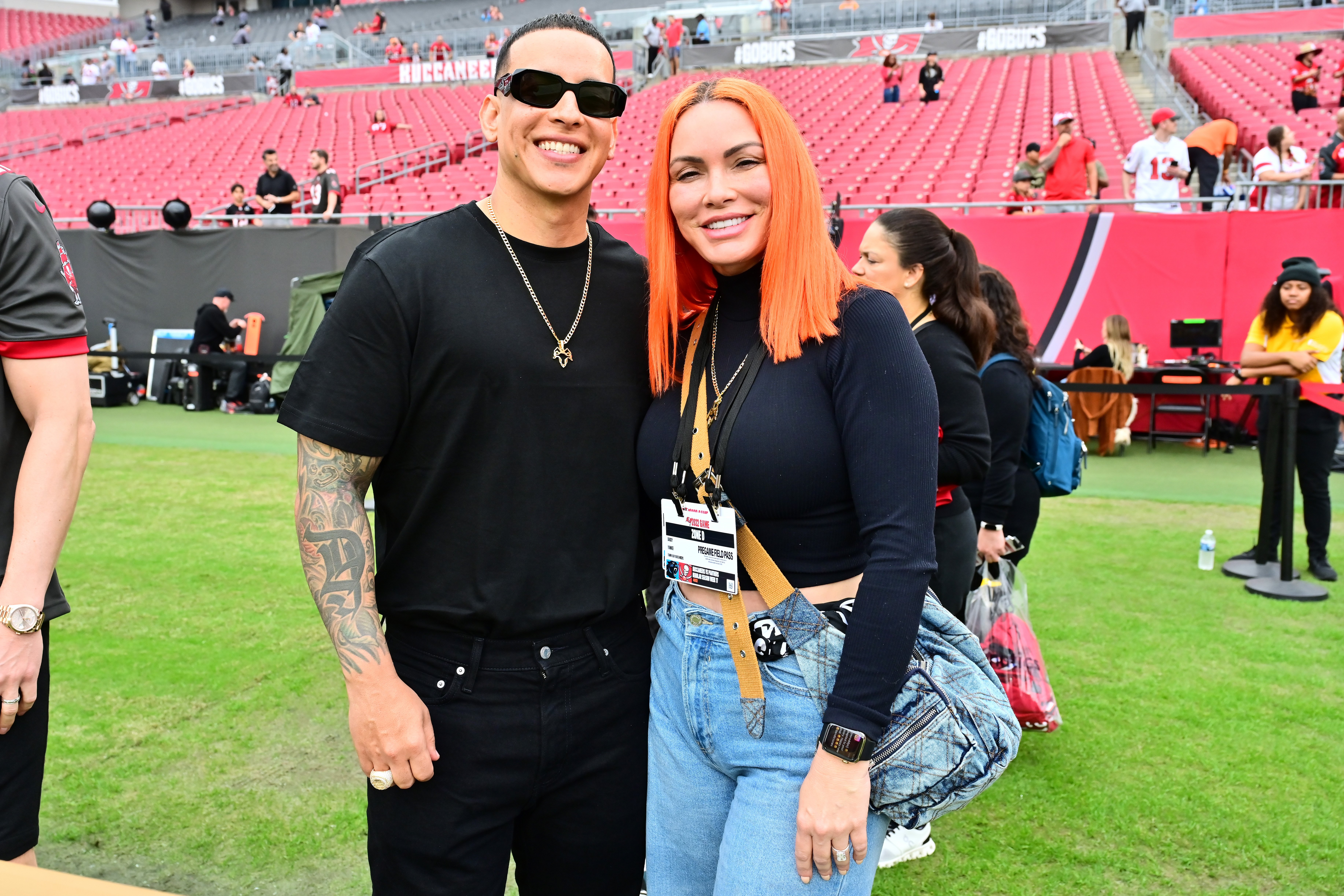 Daddy Yankee and Mireddys González at the game between the Tampa Bay Buccaneers and the Carolina Panthers on January 1, 2023, in Florida | Source: Getty Images