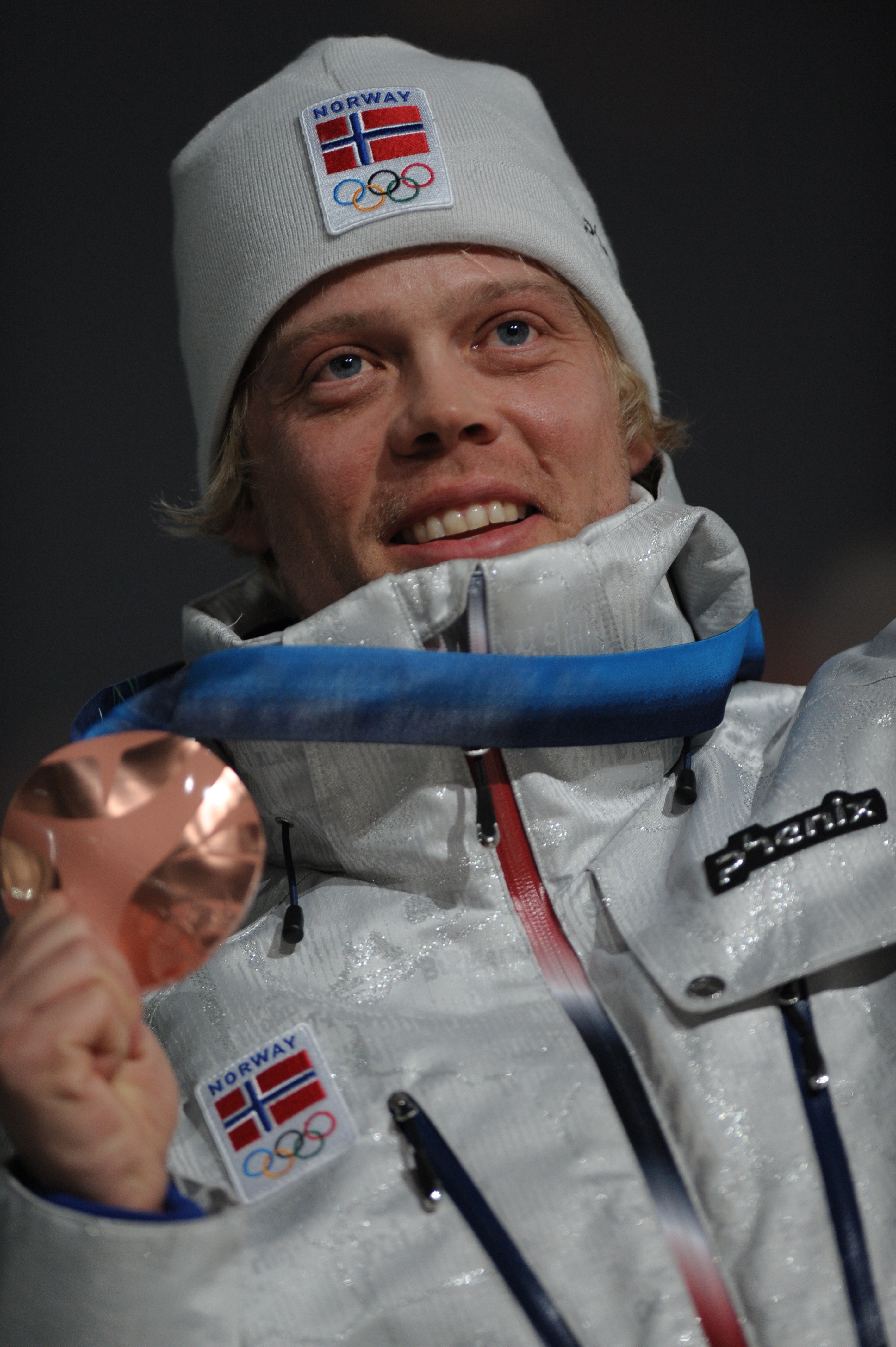 Audun Grønvold celebrates on the podium during the medal ceremony of the men's freestyle ski cross final of the Vancouver Winter Olympics, on February 21, 2010 | Source: Getty Images