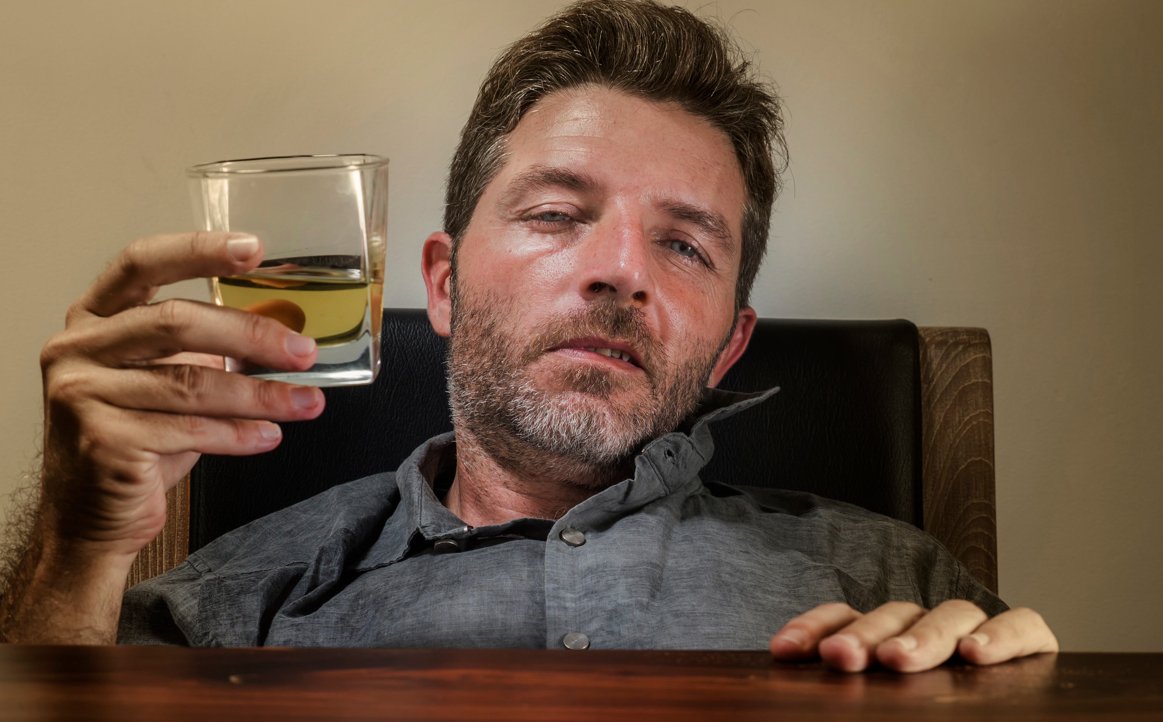 Drunk man with alcohol | Shutterstock