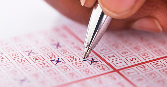 A person filling out lottery tickets. | Source: Shutterstock