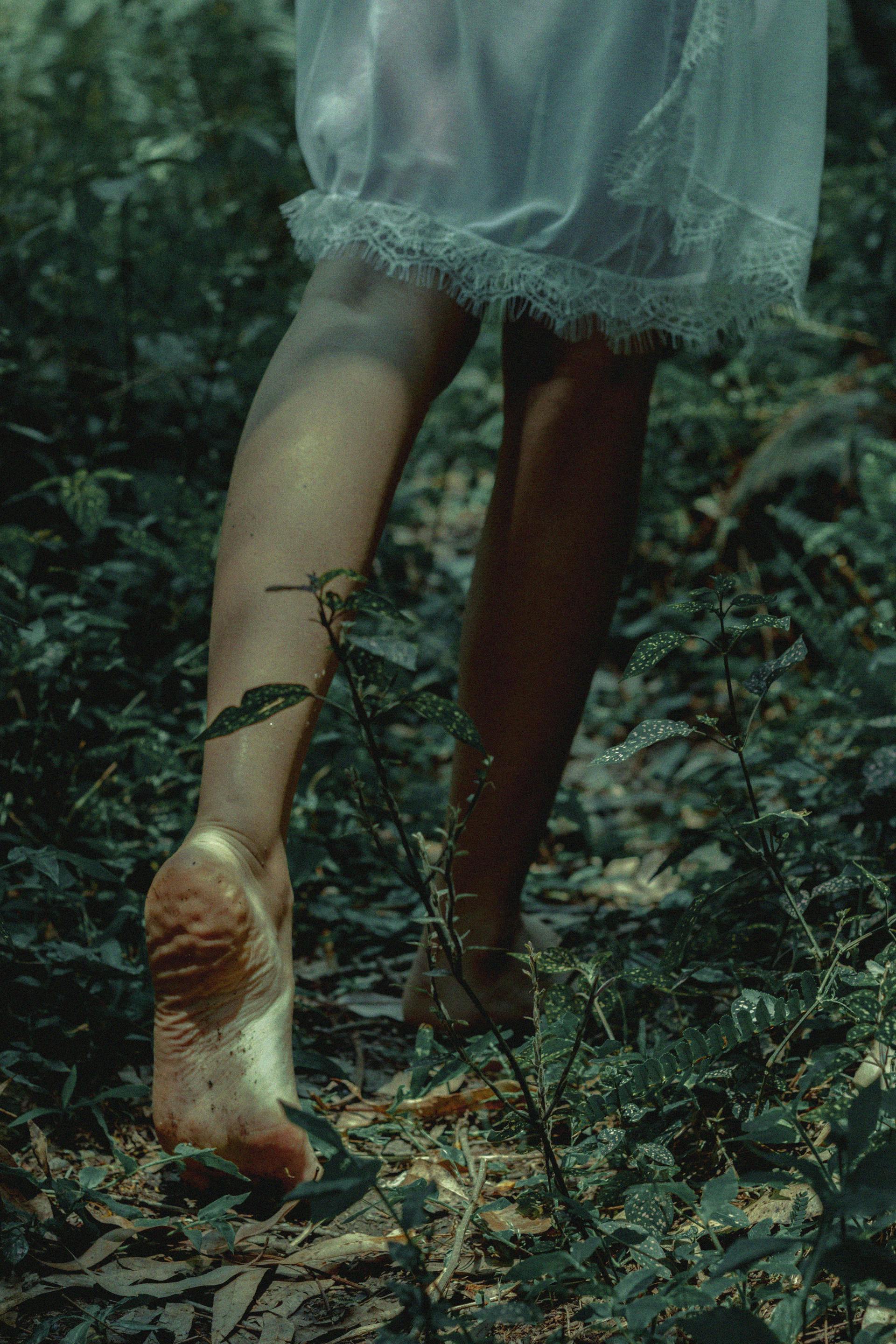 A woman walking into a forest | Source: Pexels