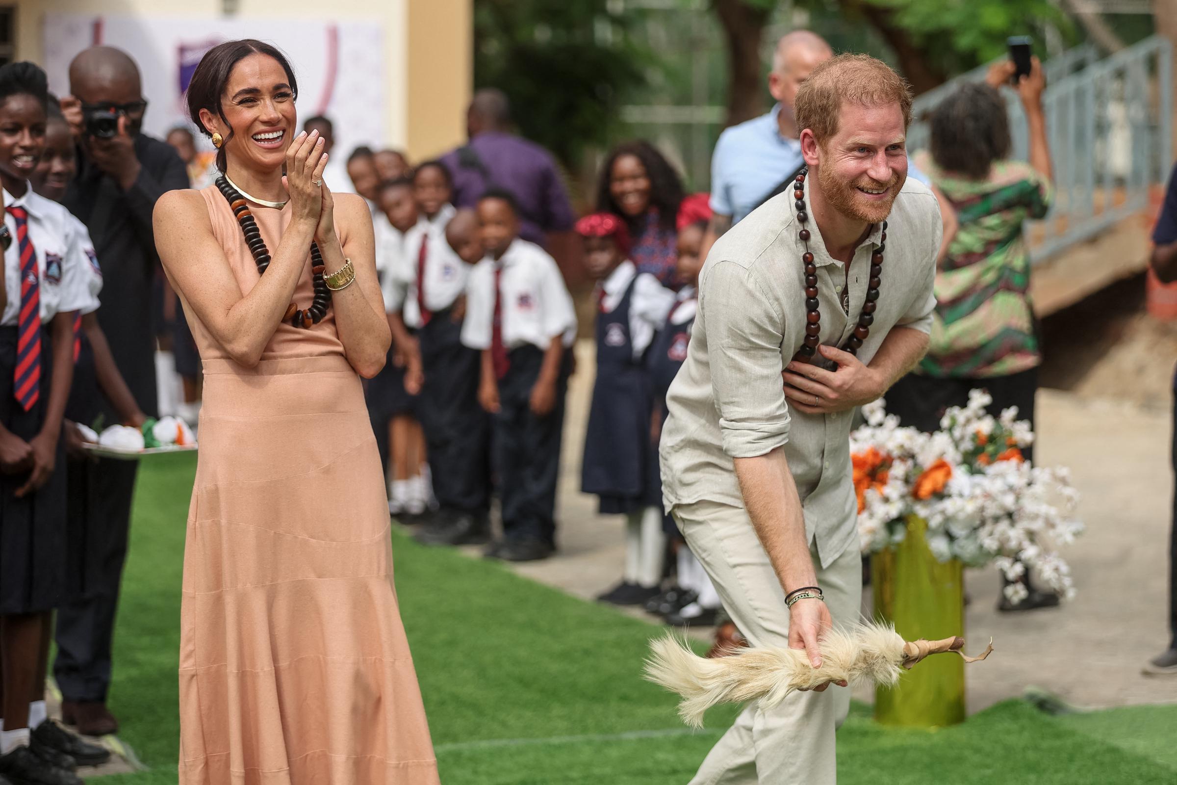 Prince Harry and Meghan Markle visit the Lightway Academy in Abuja, Nigeria on May 10, 2024. | Source: Getty Images