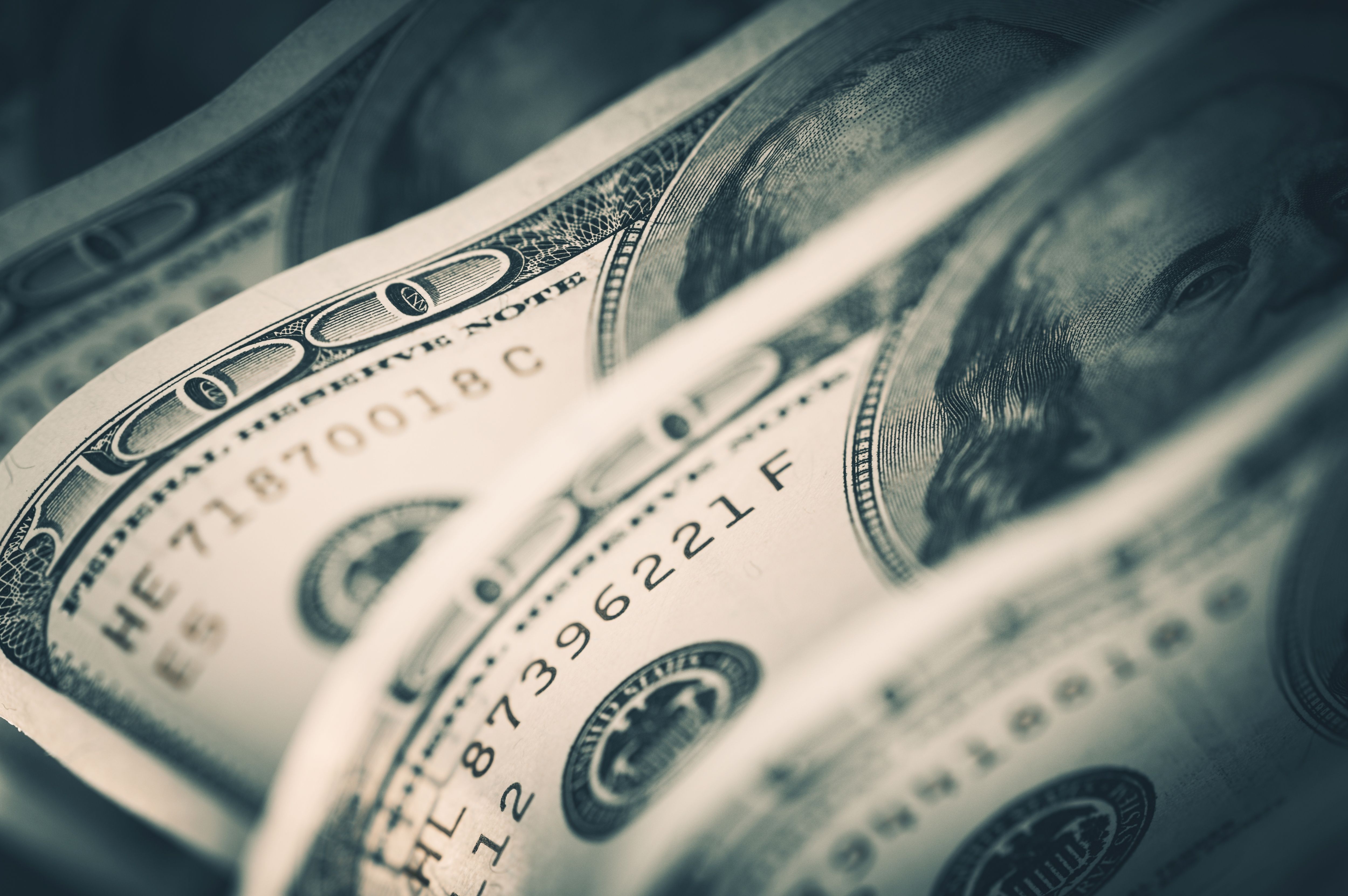 A row of $100 bills. | Source: Shutterstock 