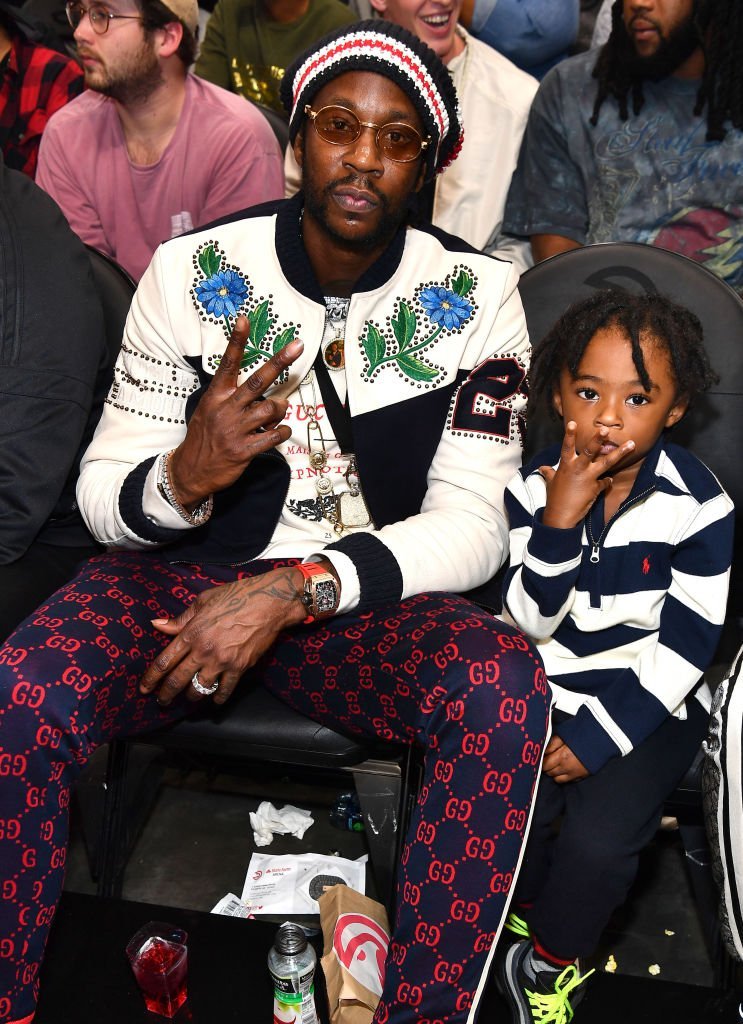 2 Chainz and his only son, Halo watching an NBA game in November 2018. | Photo: Getty Images