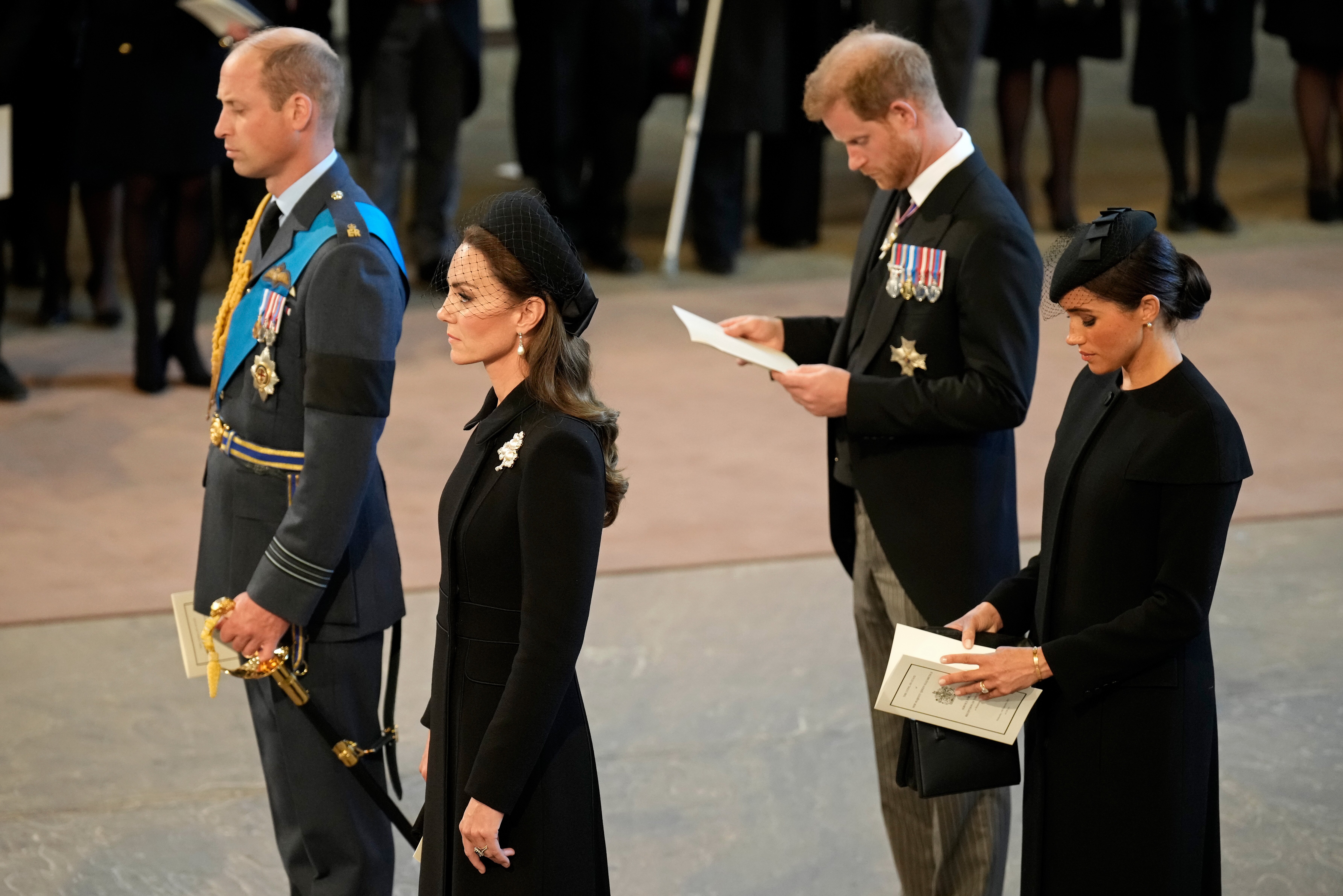 Prince William, Kate Middleton, Prince Harry, and Meghan, pay their respects inside the Palace of Westminster on September 14, 2022 in London, England | Source: Getty Images