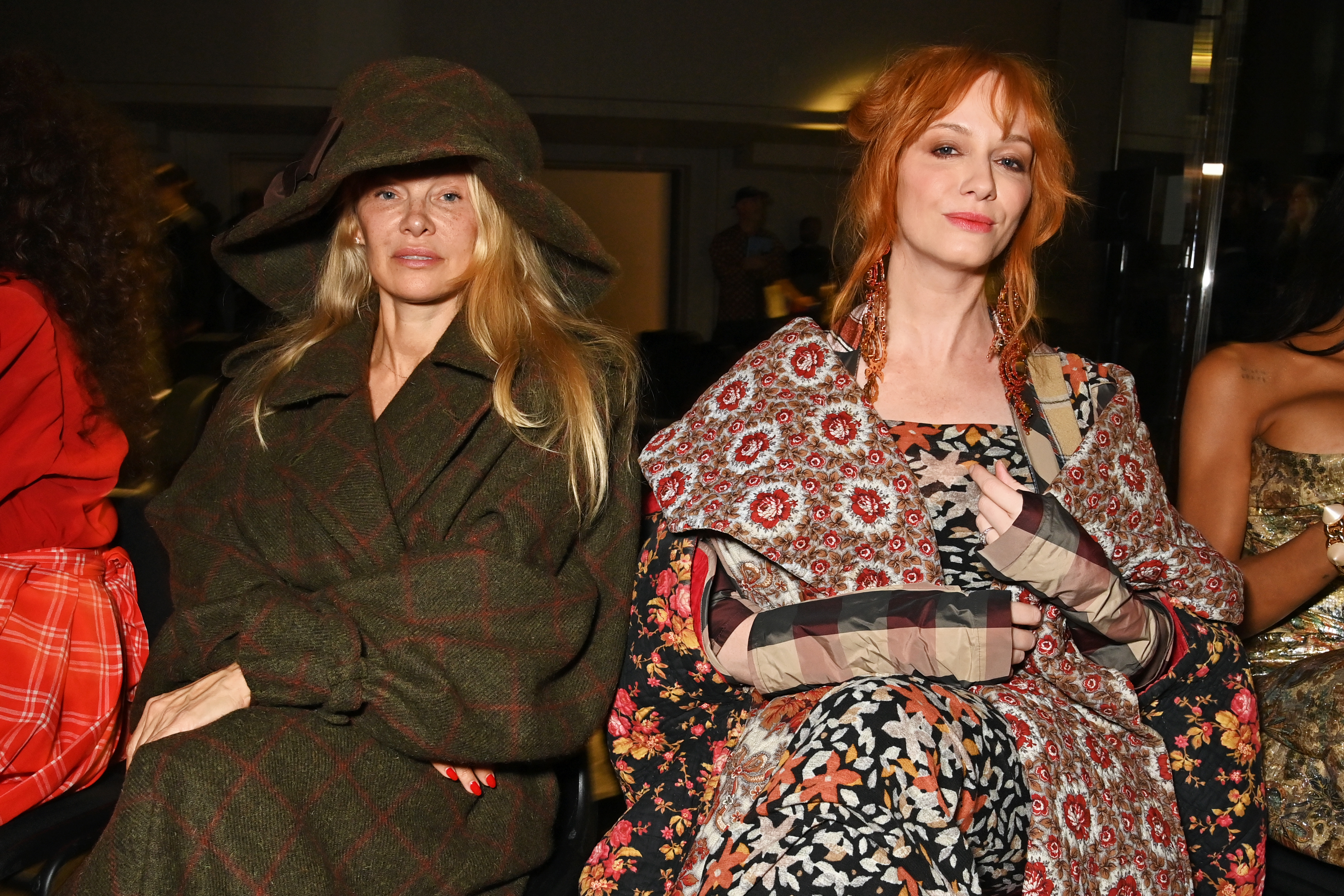 Pamela Anderson and Christina Hendricks at the Andreas Kronthaler For Vivienne Westwood SS24 show during Paris Fashion Week Womenswear Spring/Summer 2024, on September 30, 2023, in Paris, France | Source: Getty Images