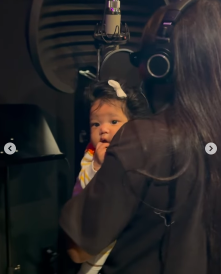 A still taken from a video clip showing Ciara holding her baby while recording in a studio. | Source: Instagram/ciara