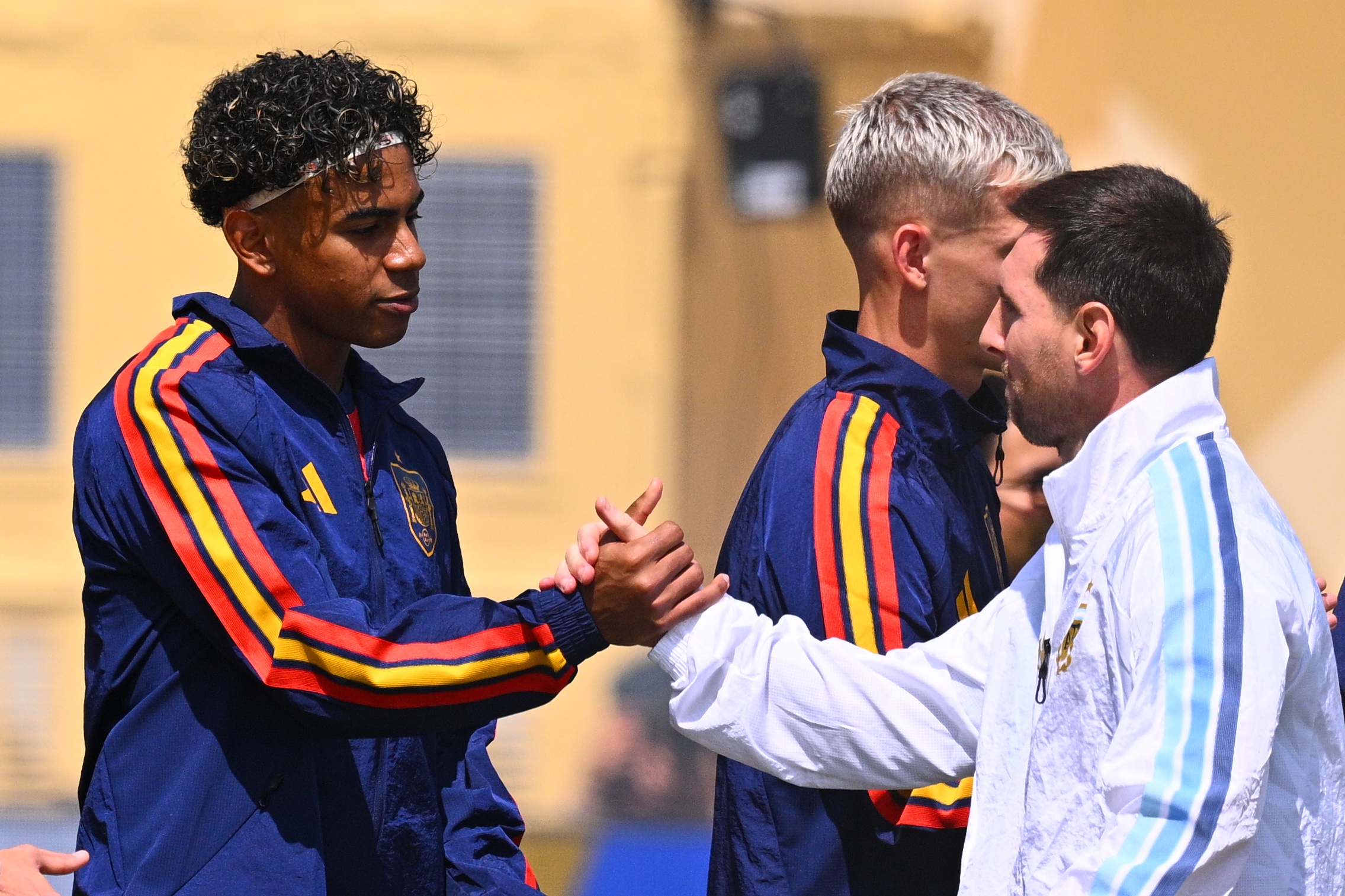 Lamine Yamal and Lionel Messi shake hands ahead of the FIFA World Cup 2026 final between Spain and Argentina at New York New Jersey Stadium on July 19 in East Rutherford, New Jersey. | Source: Getty Images