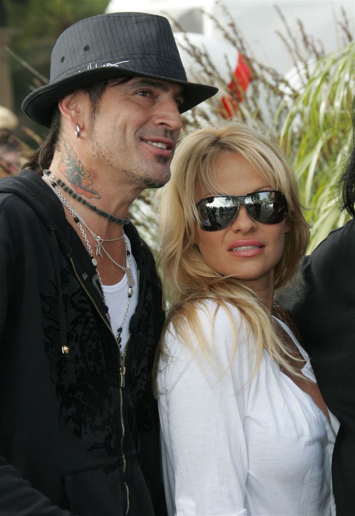 Musician Tommy Lee and actress Pamela Anderson pose at the home of John Paul DeJoria, CEO and co-founder of John Paul Mitchell Haircare Systems | Getty Images