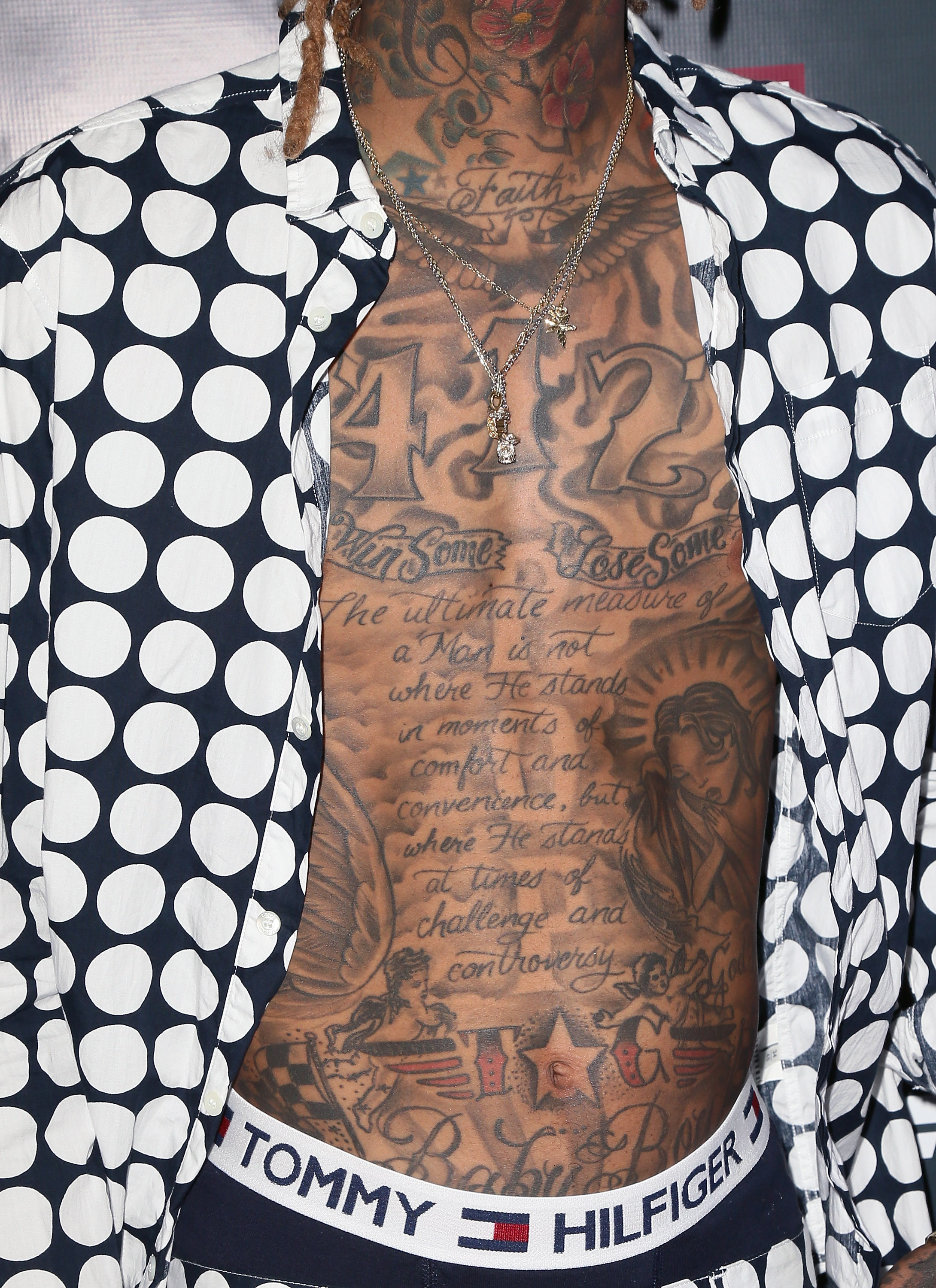 A close-up of Wiz Khalifa's tattoos captured while he attended the exclusive "Furious 7" Takeover event on April 1, 2015, in Hollywood, California. | Source: Getty Images