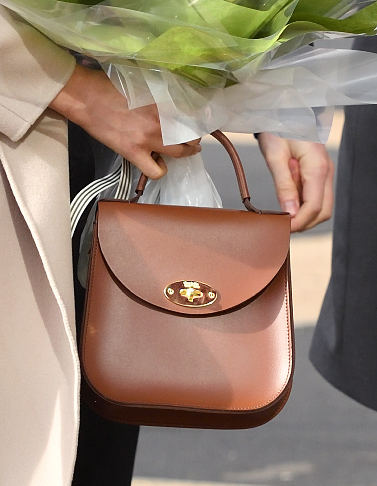 Meghan Markle carrying a Charlotte Elizabeth handbag in Northern Ireland in 2018 | Source: Getty Images