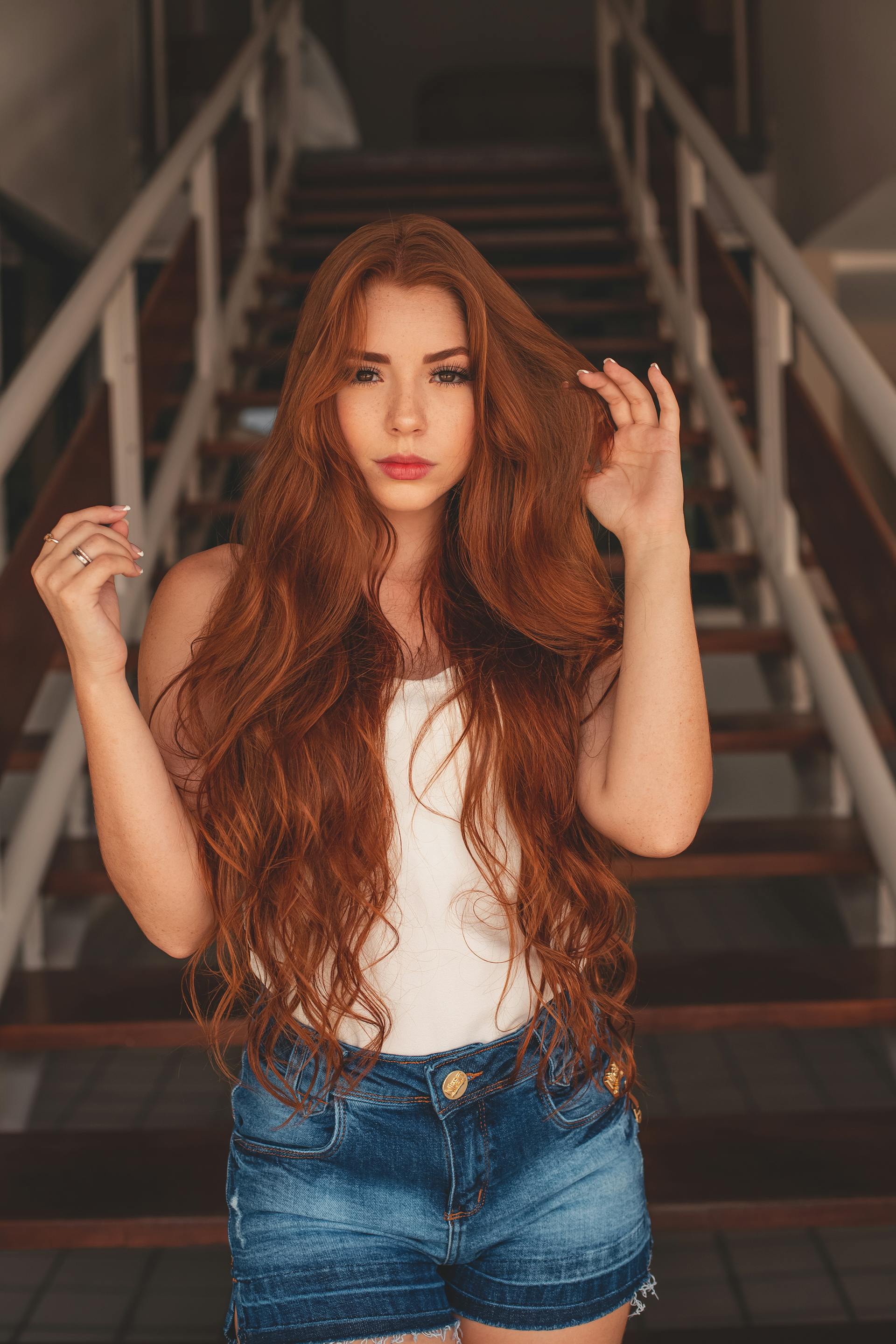 A woman in front of a staircase | Source: Pexels