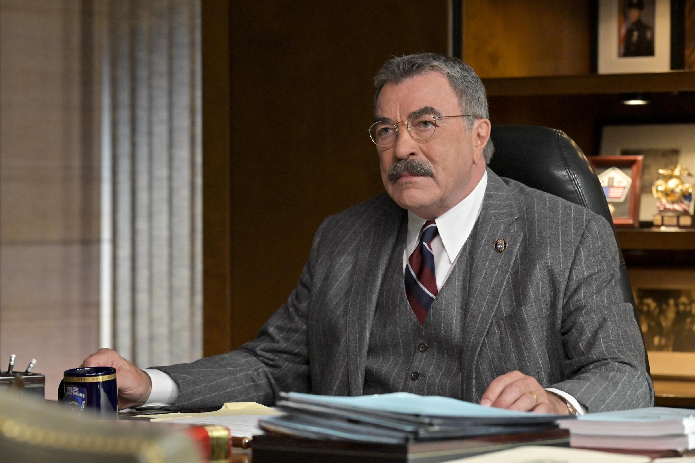 Many celebrities are used in these types of scams, so Tom Selleck most likely isn't at fault. Here he is as Frank Reagan on the set of "Blue Bloods" during the "Poetic Justice" episode on December 9, 2022 | Source: Getty Images