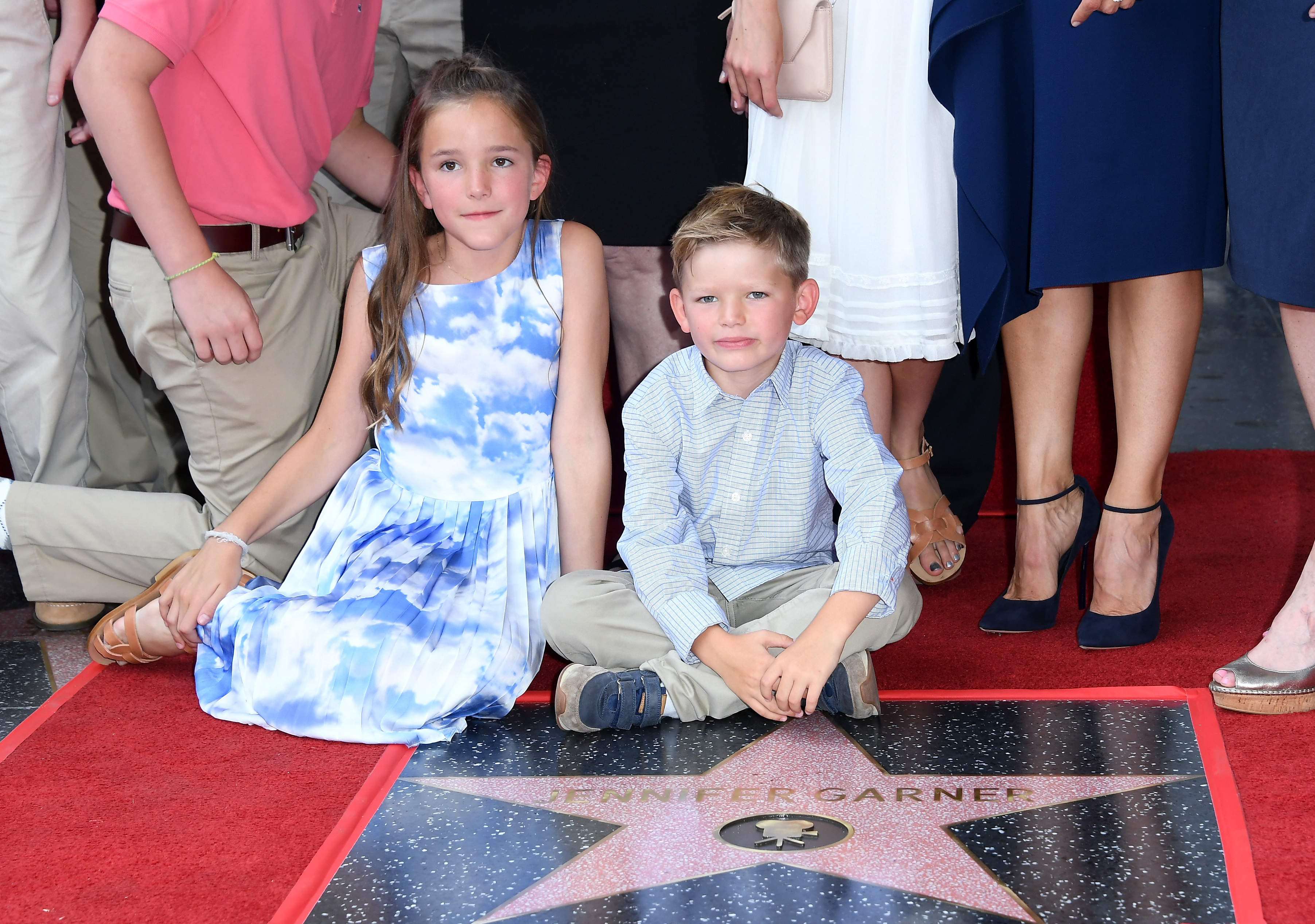 Seraphina and Samuel Garner Affleck sit close to Jennifer Garner's star on the Hollywood Walk Of Fame on August 20, 2018, in Hollywood, California. | Source: Getty Images