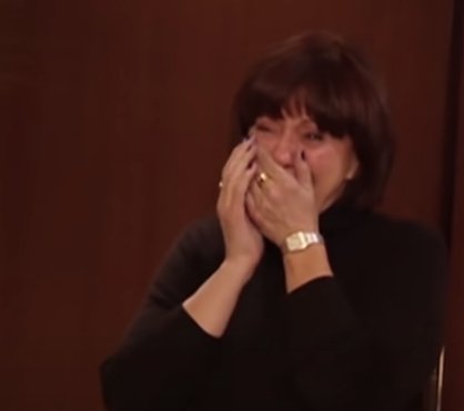 Linda crying. | Source: youtube.com/OWN