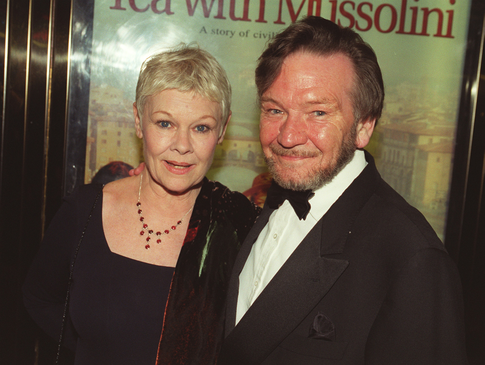 Dame Judi Dench and Michael Williams at the Royal Premiere of her film "Tea With Mussolini," at the Empire Leicester Square in London on March 18, 1999. | Source: Getty Images