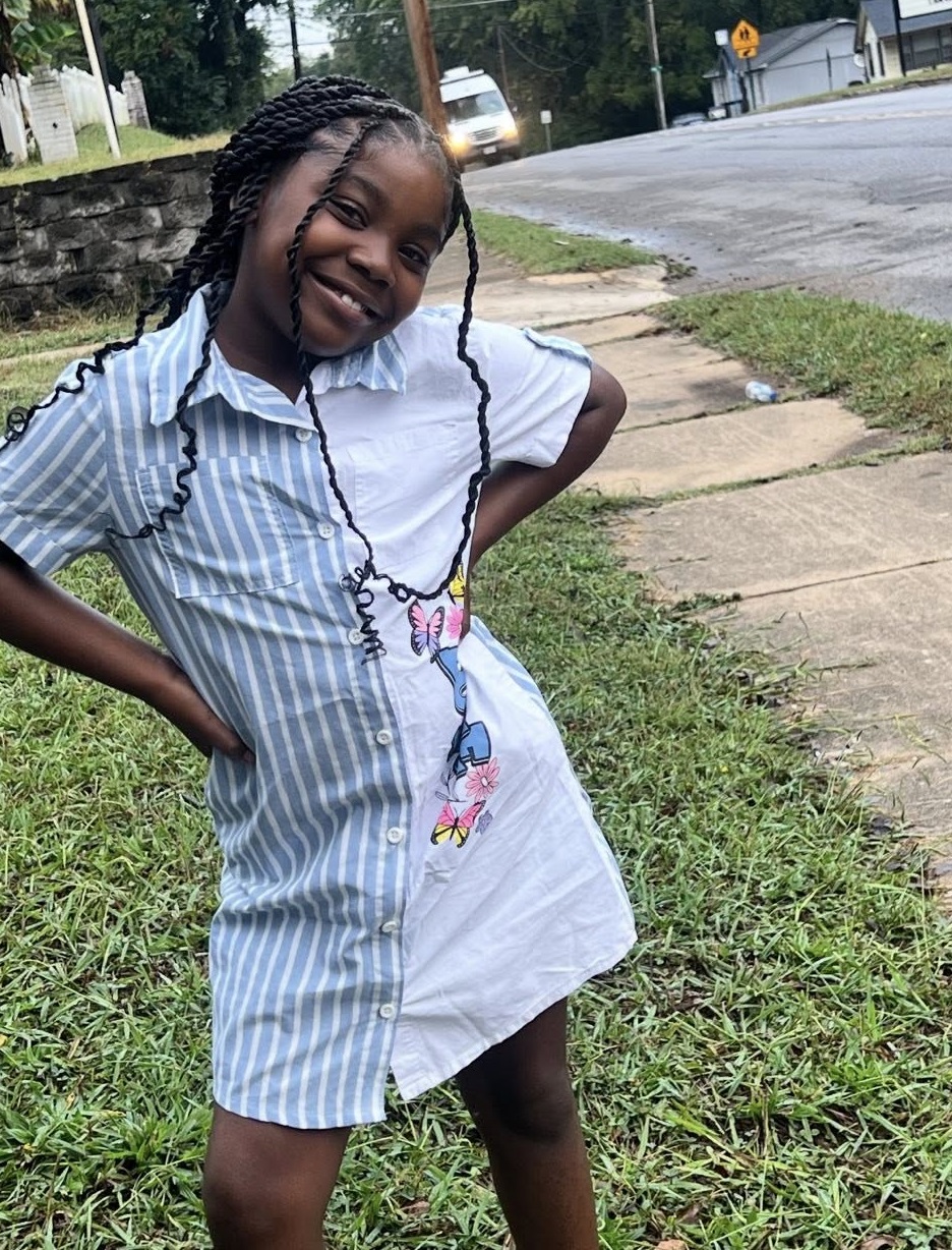 Lola Scott couldn't have known what would happen. In this photo, she posed in her front yard smiling on May 31, 2026 | Source: Facebook/Lisa Hood