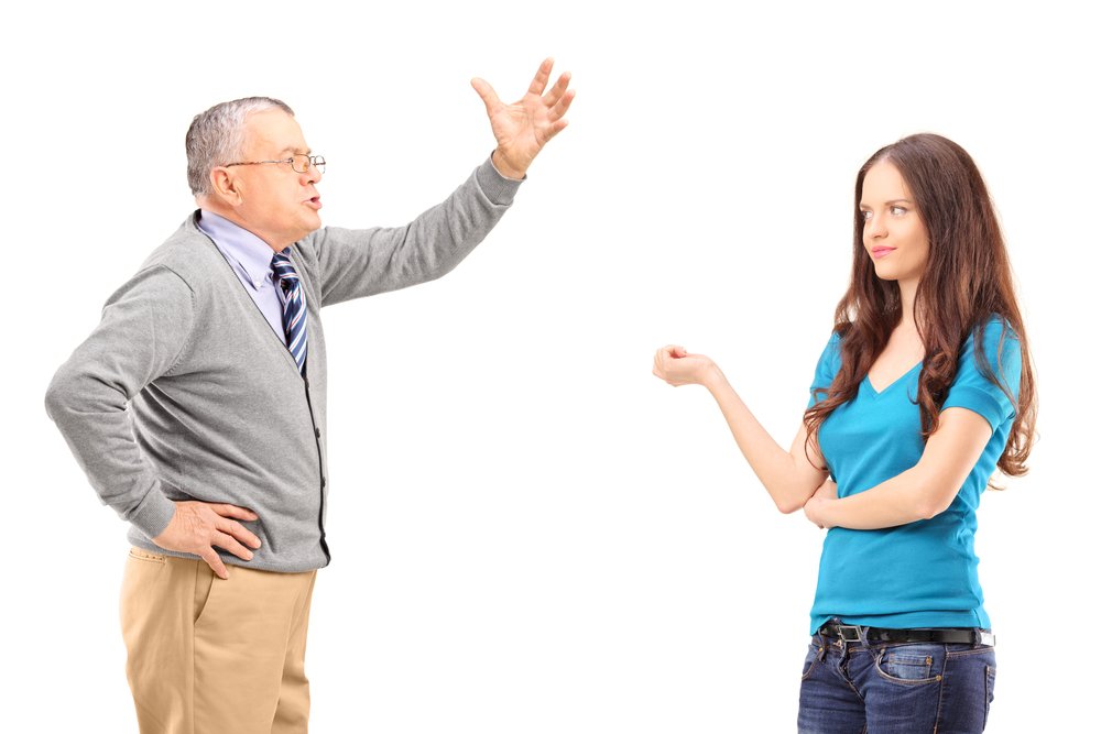 An angry man shouting at a woman. | Photo: Shutterstock