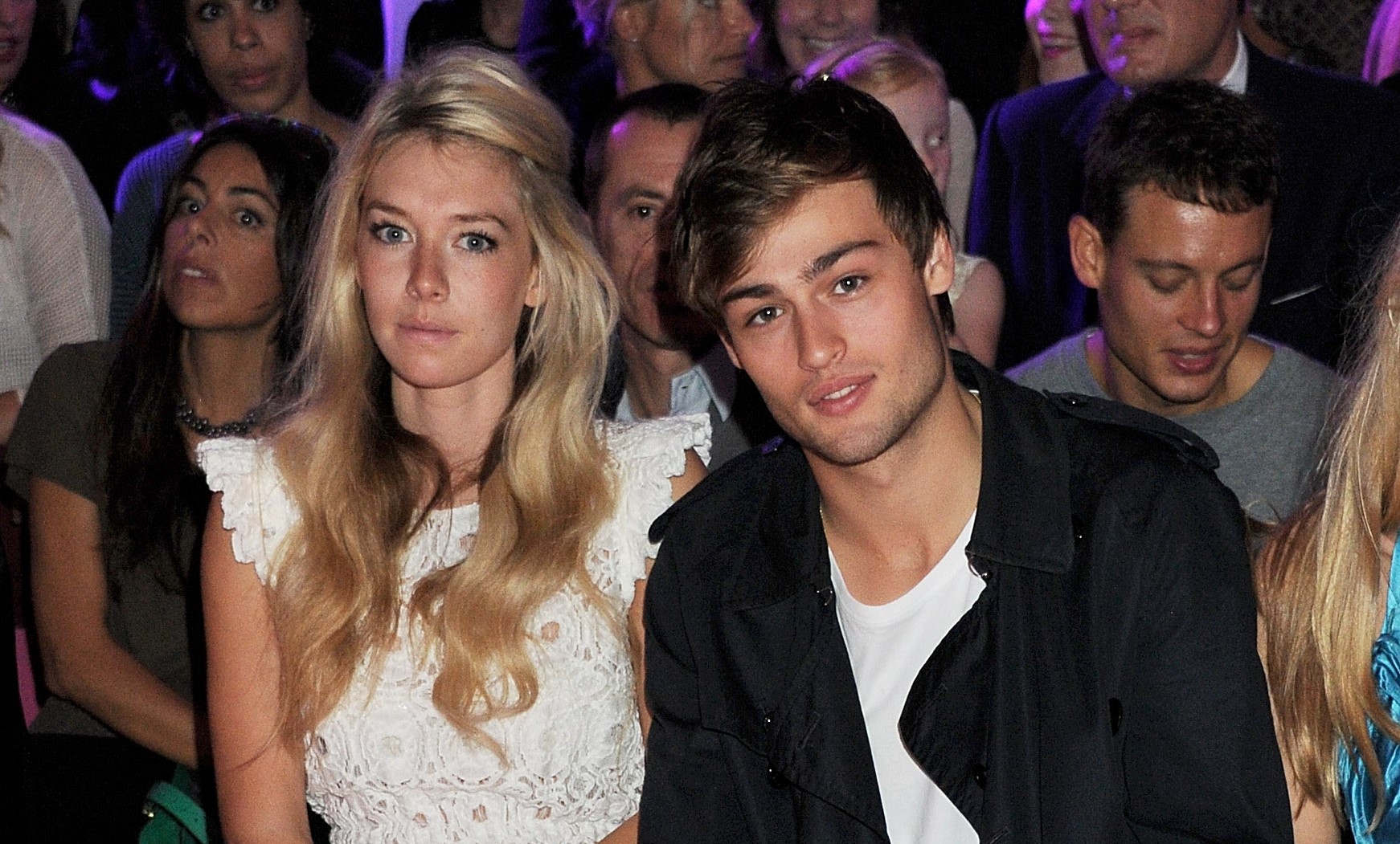 Vanessa Kirby (L) and Douglas Booth sit in the front row at the Mulberry Spring/Summer 2012 runway show during London Fashion Week at Claridges Hotel, on September 18, 2011, in London, England. | Source: Getty Images