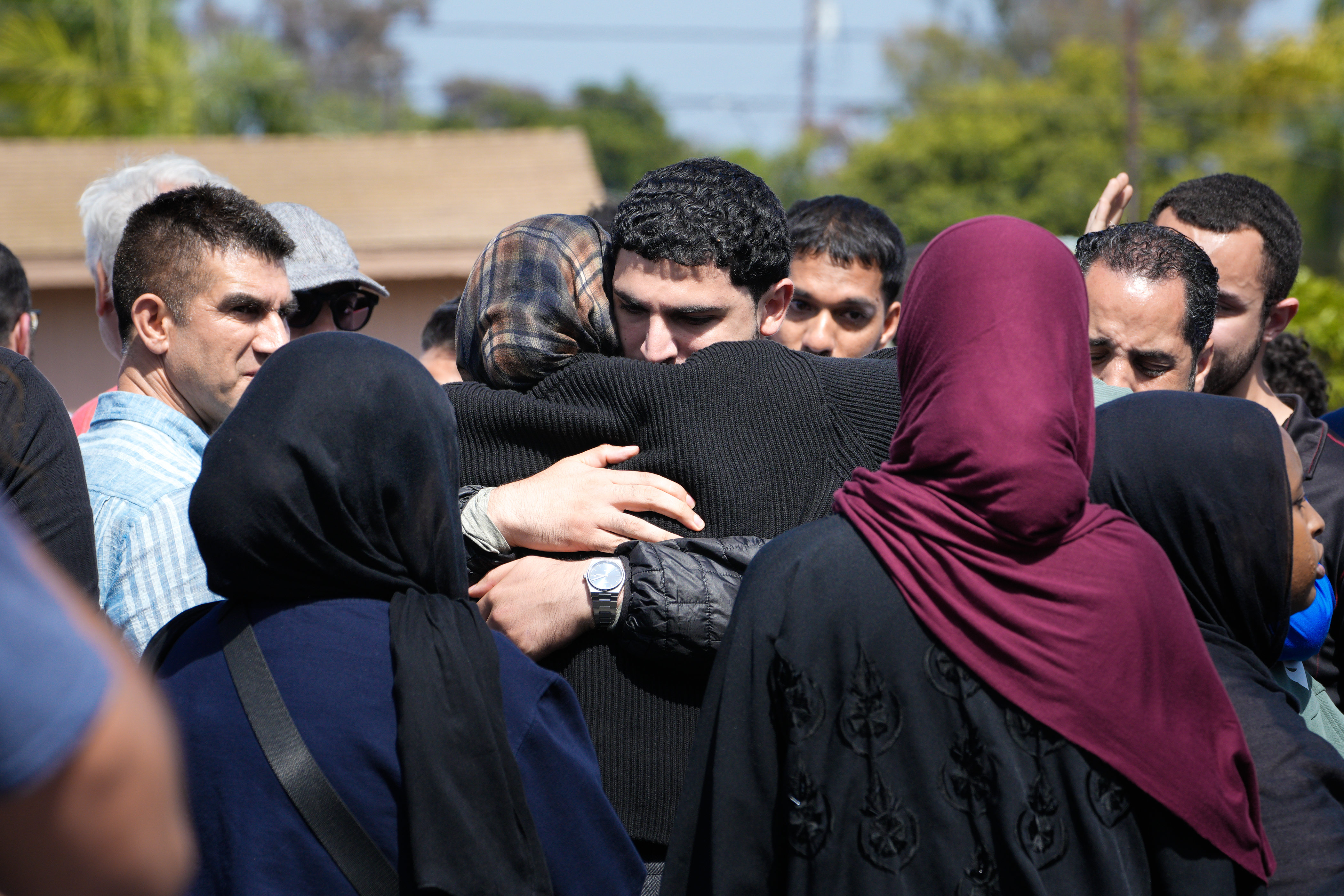 Families evacuate the area surrounding the Islamic Center of San Diego on May 18, 2026 | Source: Getty Images