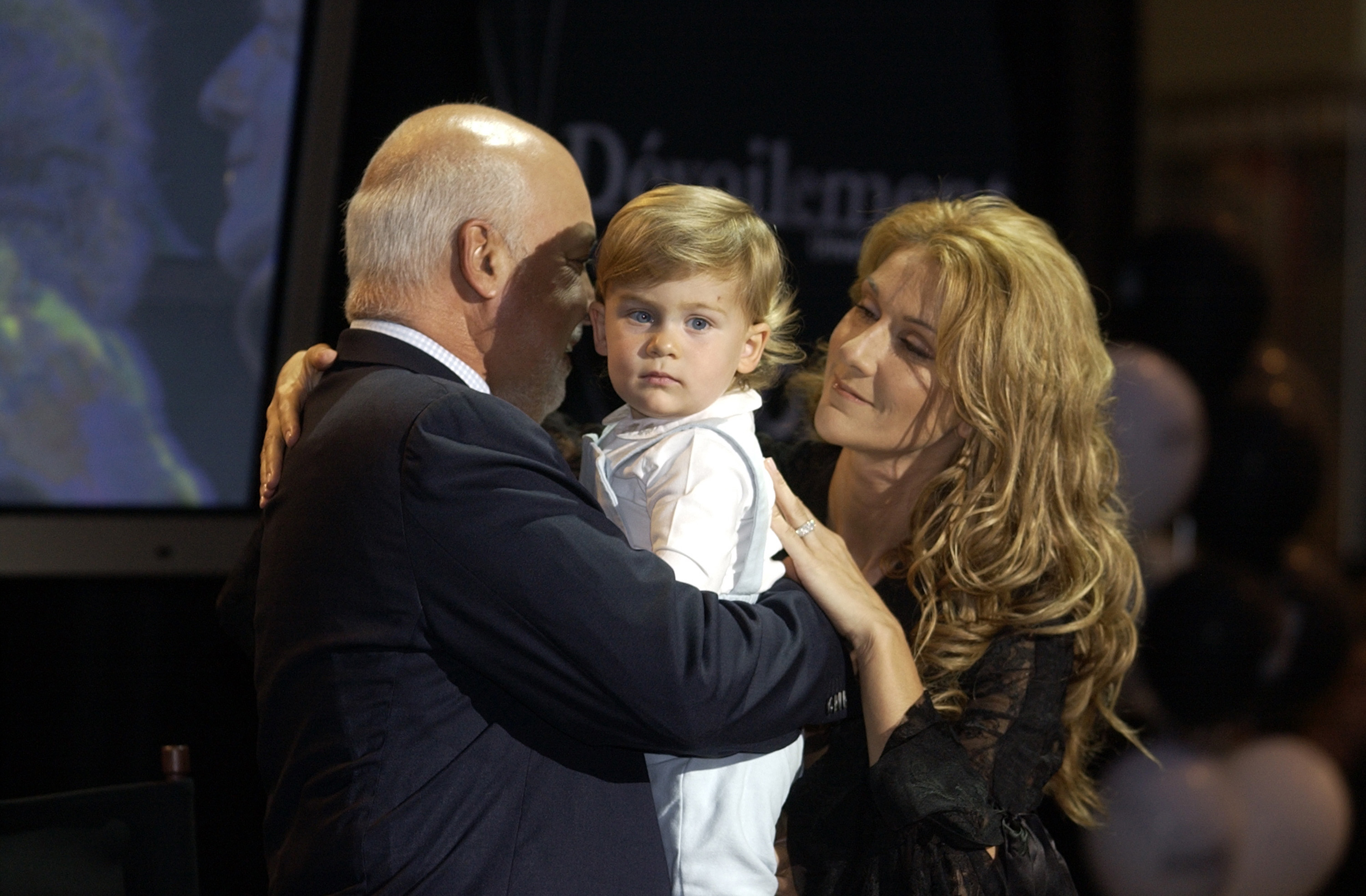 Rene Angelil, Rene-Charles and Celine Dion at the Pepsi Forum in Montreal, Canada on September 26, 2002 | Source: Getty Images