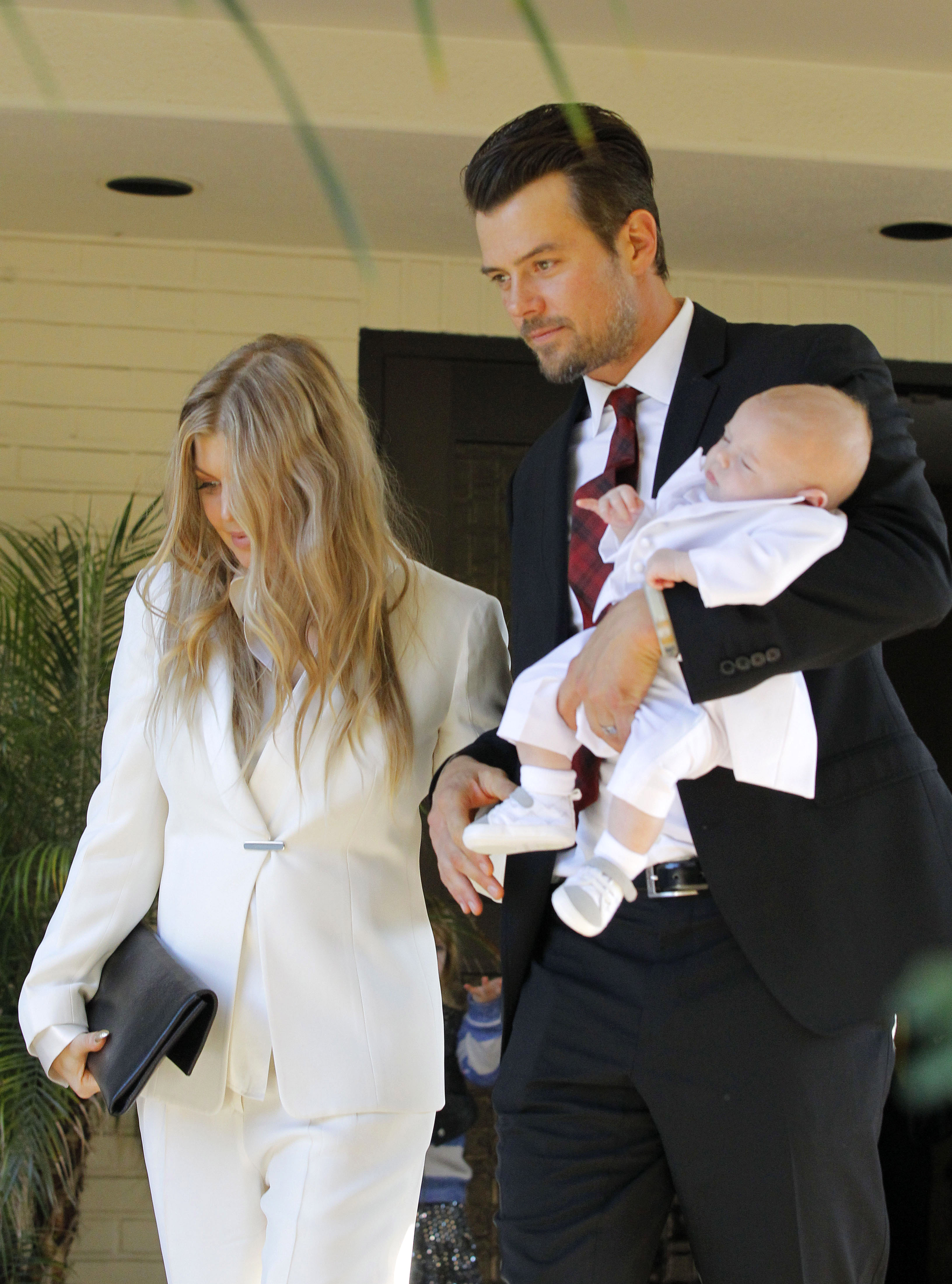 Fergie and Josh Duhamel with their son Axl Duhamel pictured on December 12, 2013 in Los Angeles, California | Source: Getty Images