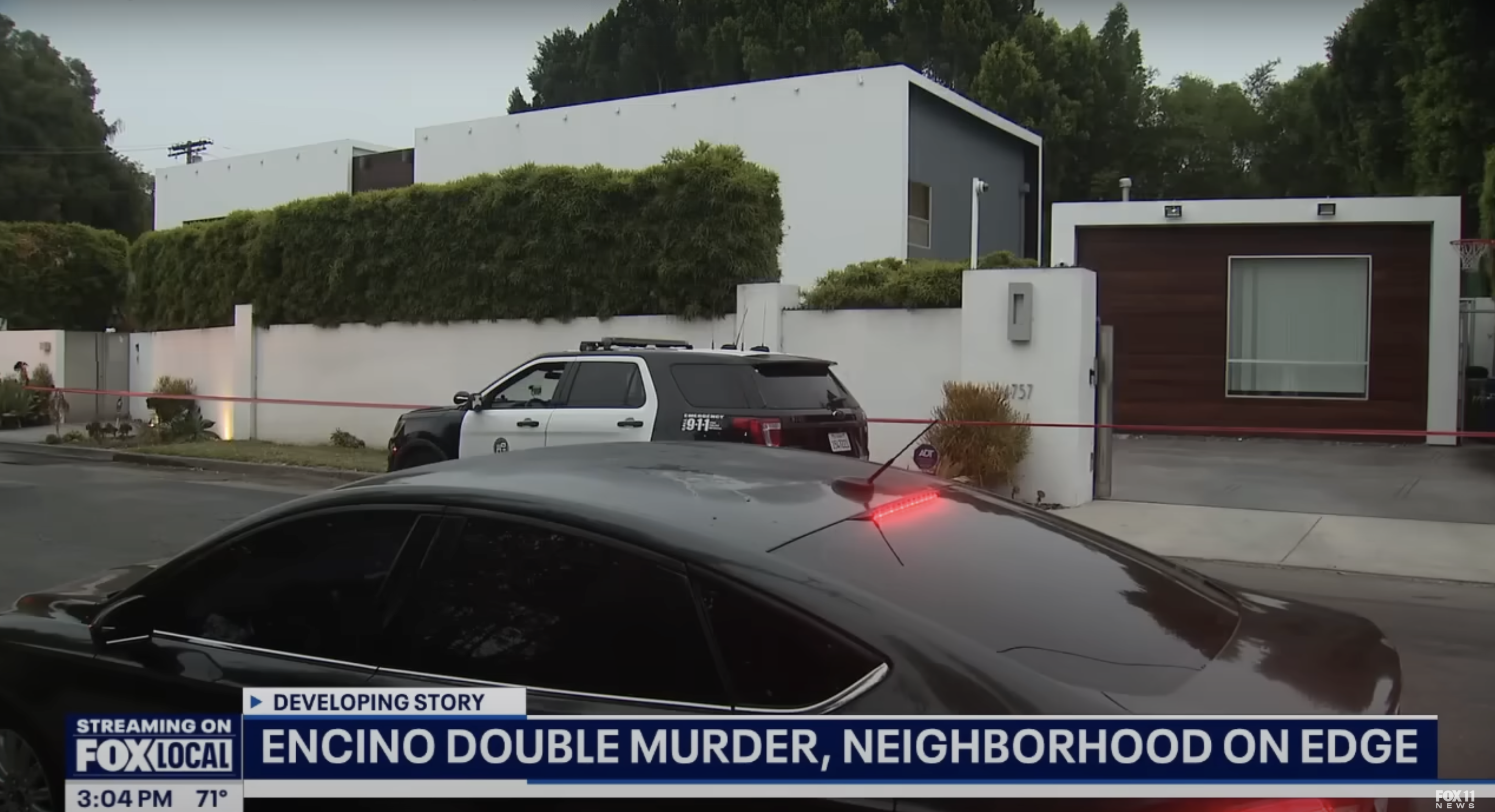 Police vehicles are seen outside Robin Kaye's residence, in a video dated July 16, 2025 | Source: YouTube/Foxla