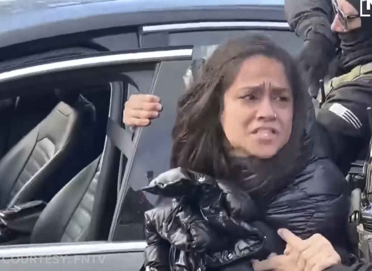 A distressed woman being mishandled by ICE Agents from a video posted on January 14, 2026 | Source: YouTube/@NewsNation