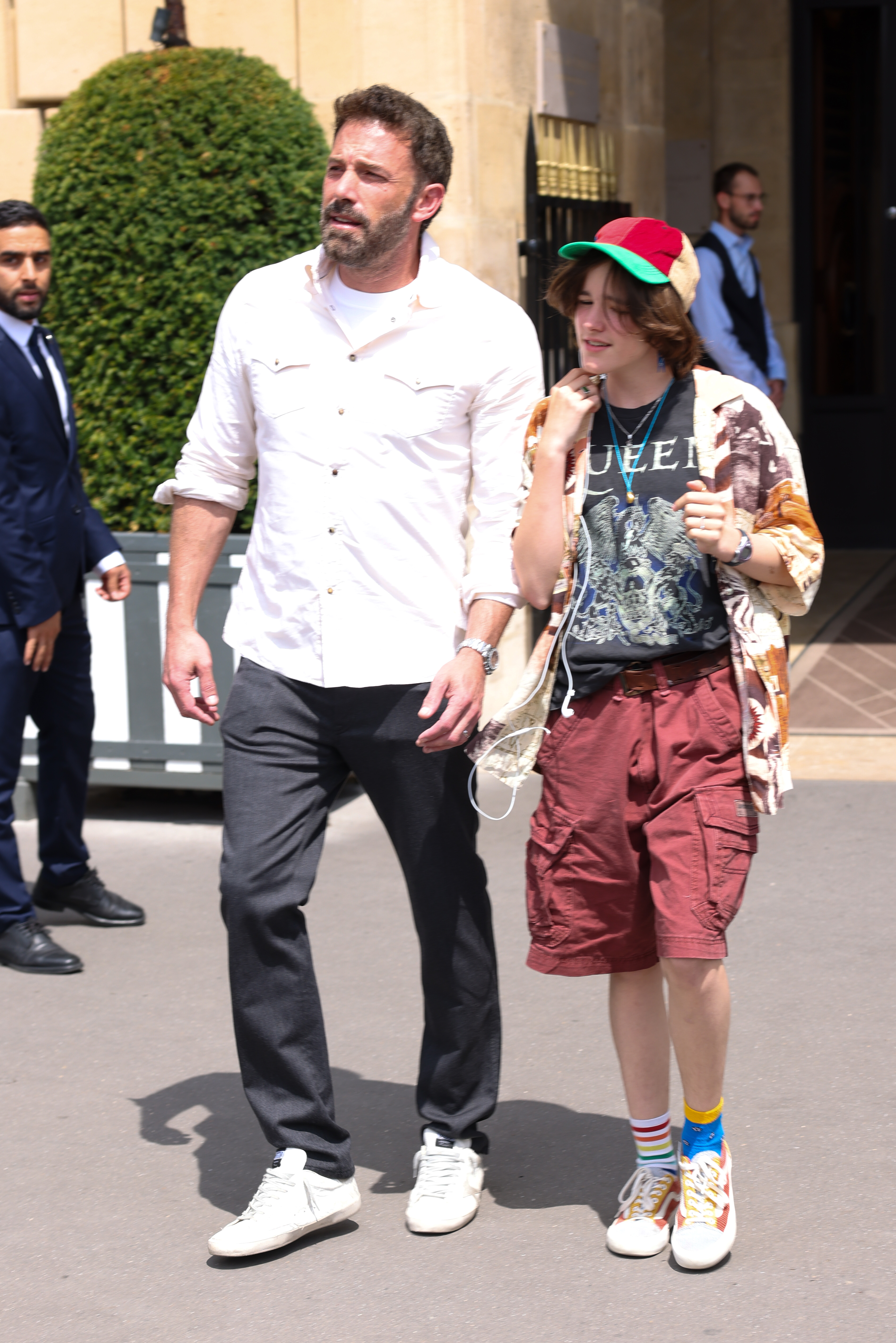 Ben Affleck and Fin — then publicly known as Seraphina — leave Le Crillon hotel in Paris on July 25, 2022. Fin paired colorful striped socks with high-top sneakers, an early example of the playful style seen again in later public outings. | Source: Getty Images