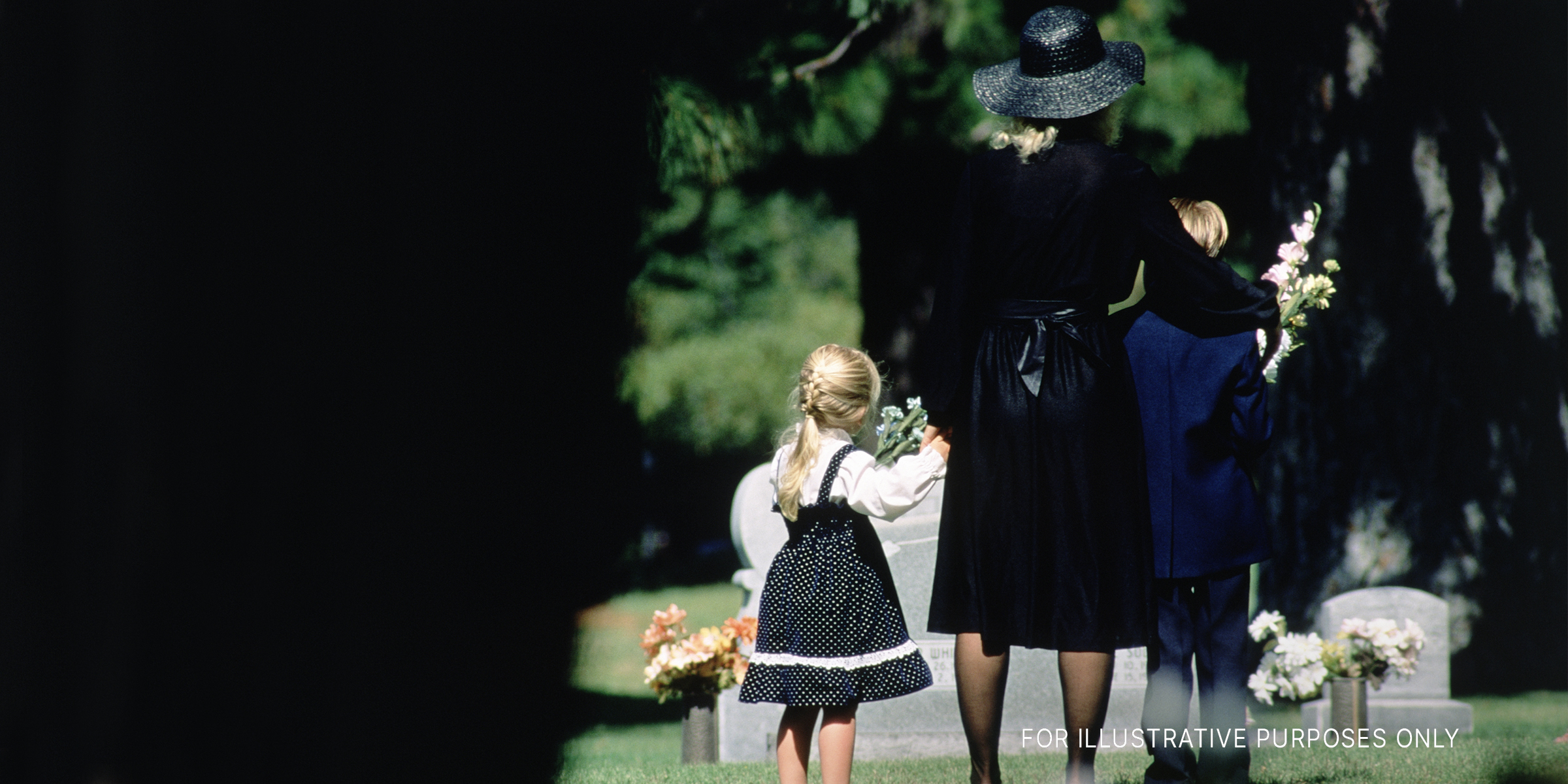 A mother and her children attend a funeral | Source: Getty Images