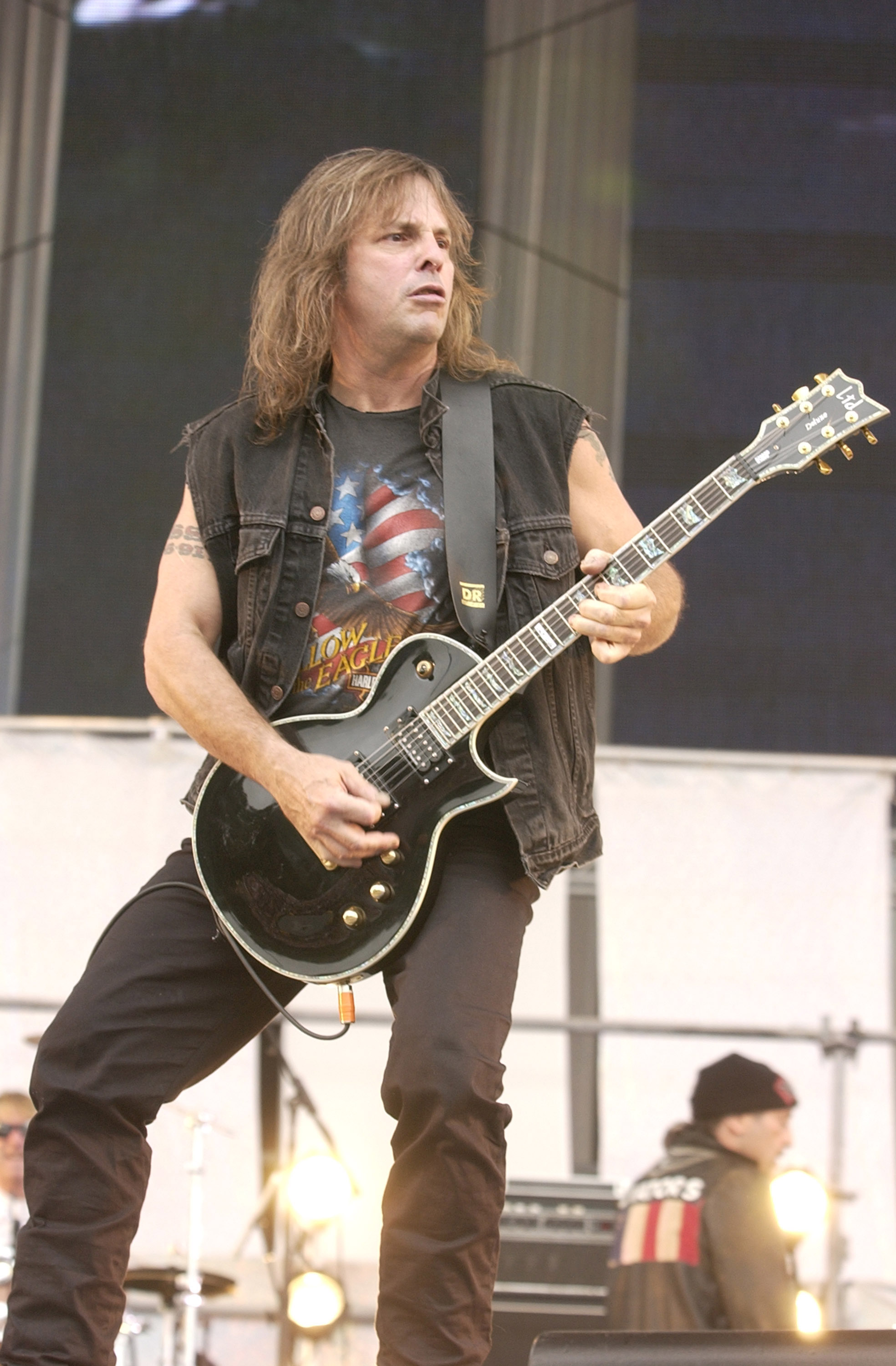 The musician performing during Little Steven's Underground Garage Festival, presented by Dunkin' Donuts, on August 14, 2004, at Randall's Island in New York. | Source: Getty Images