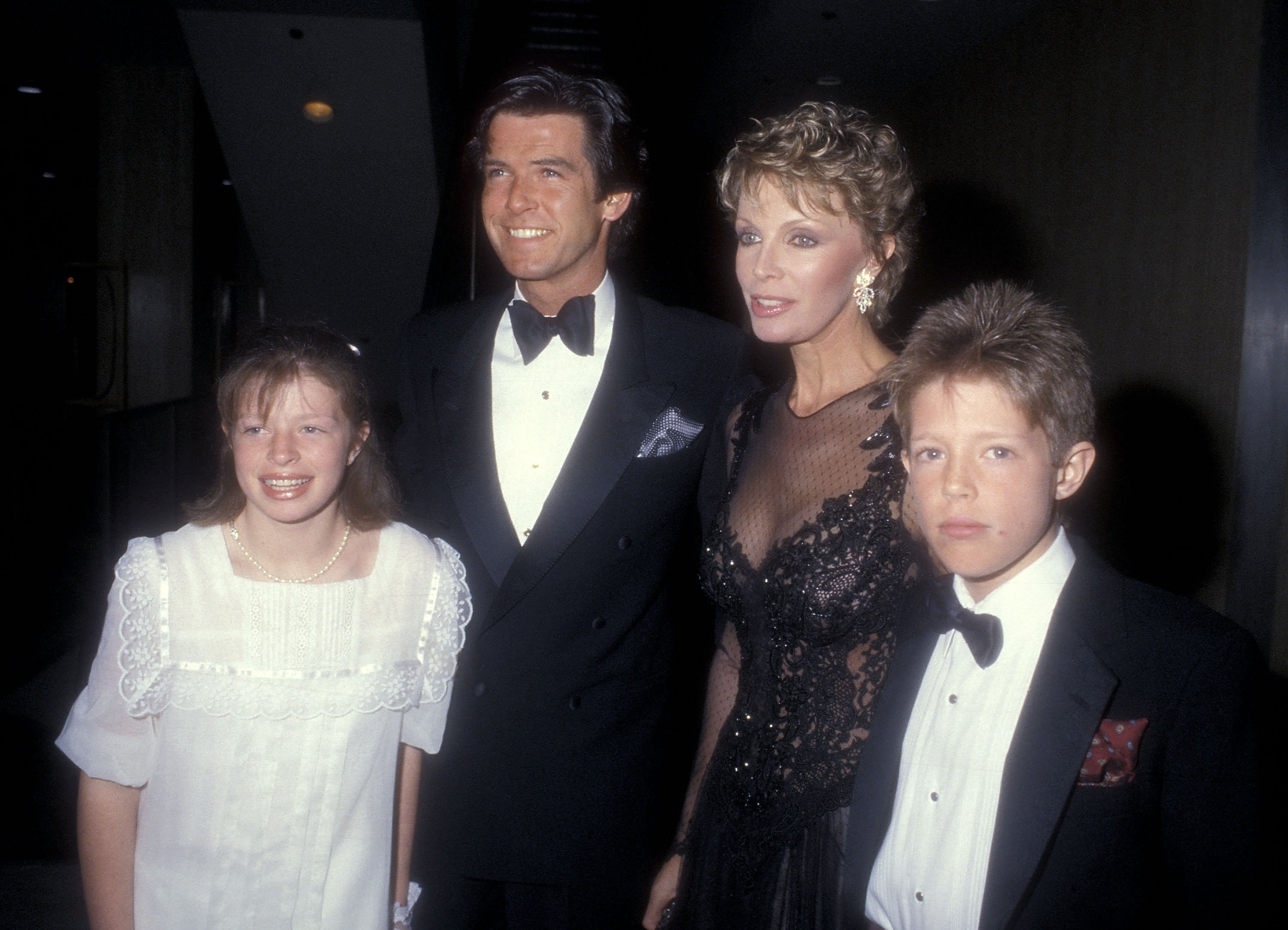 Actor Pierce Brosnan, wife Cassandra Harris, daughter Charlotte Harris and Christopher Harris attend the "Cats" Opening night musical performance on January 11, 1985 at the Shubert Theater in Century City, CA.  |  Source: Getty Images