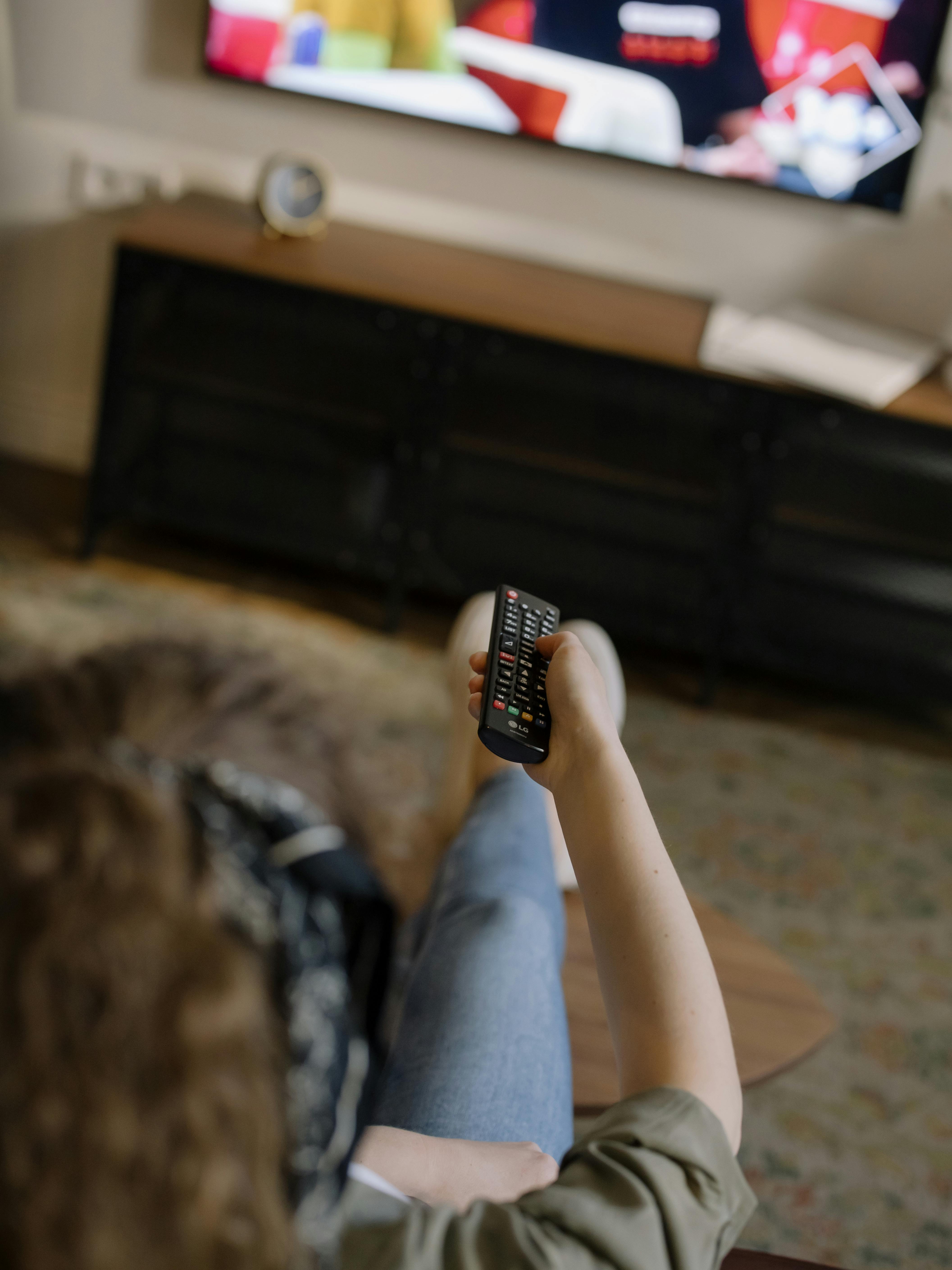A woman watching television | Source: Pexels