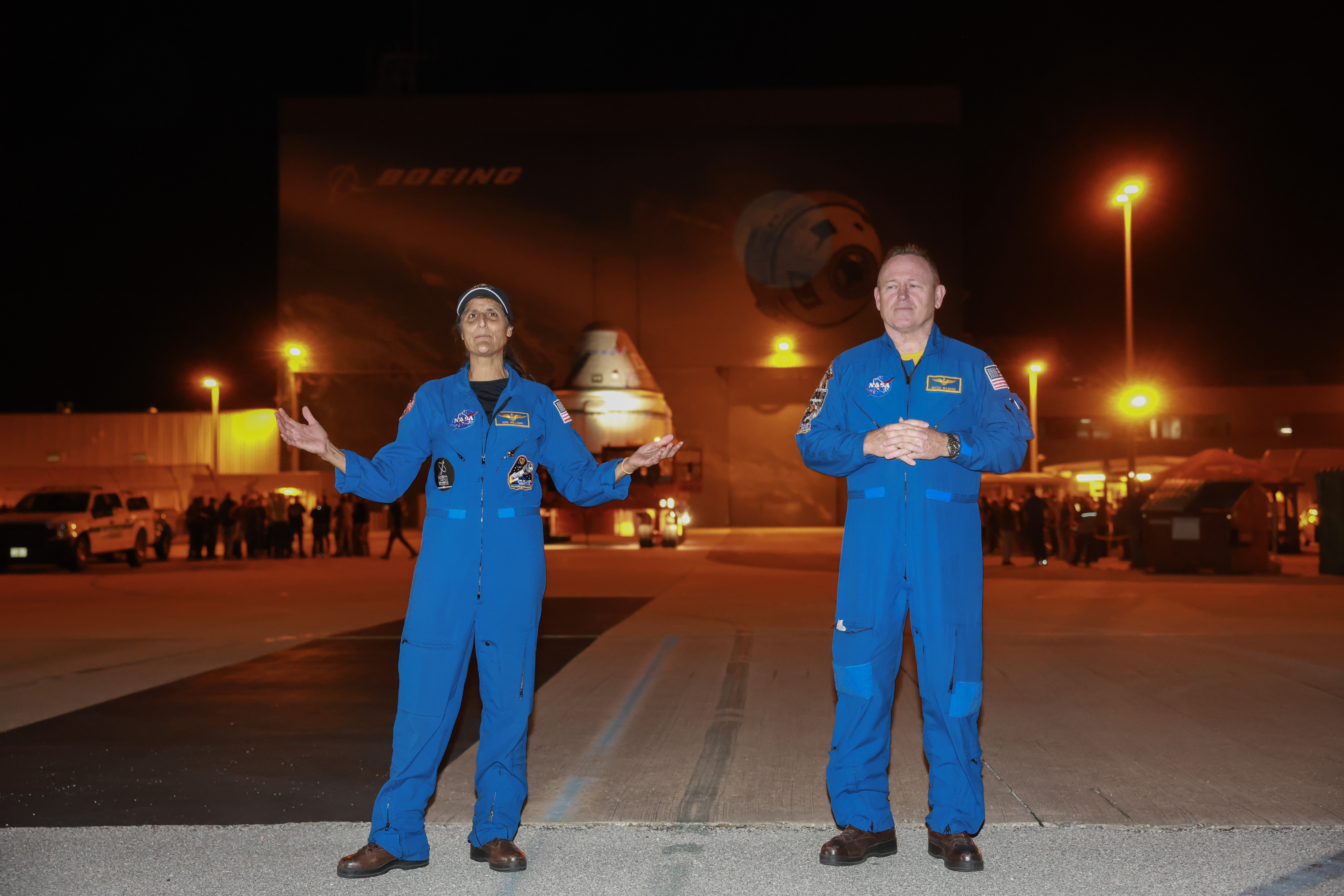 Suni Williams and Butch Wilmore speak to the media as the Boeing's CST-100 Starliner spacecraft rolls out of the Commercial Crew and Cargo Processing Facility, on April 16, 2024 | Source: Getty Images