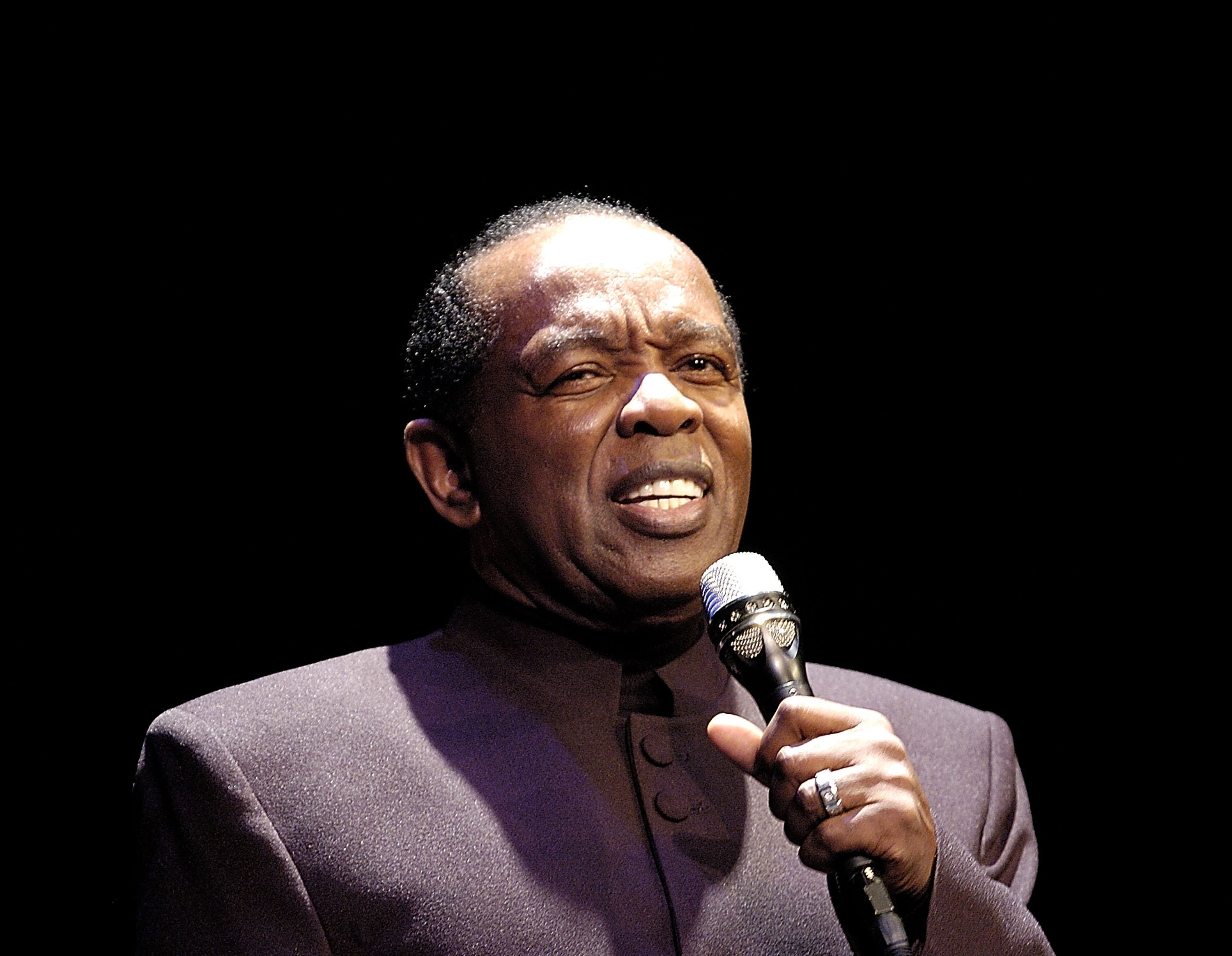 Singer Lou Rawls performs at the inaugural event for the Lou Rawls Center For The Performing Arts located at Florida Memorial College on February 3, 2005 in Miami, Florida. | Source: Getty Images