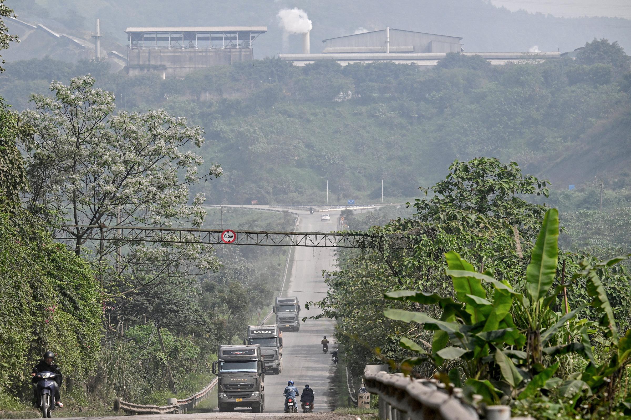 Vehicles photographed driving past the Duc Giang Lao Cai chemical plant in the Tang Loong Industrial Park on 19 March 2026 in Lao Cai Province, northern Vietnam. | Source: Getty Images