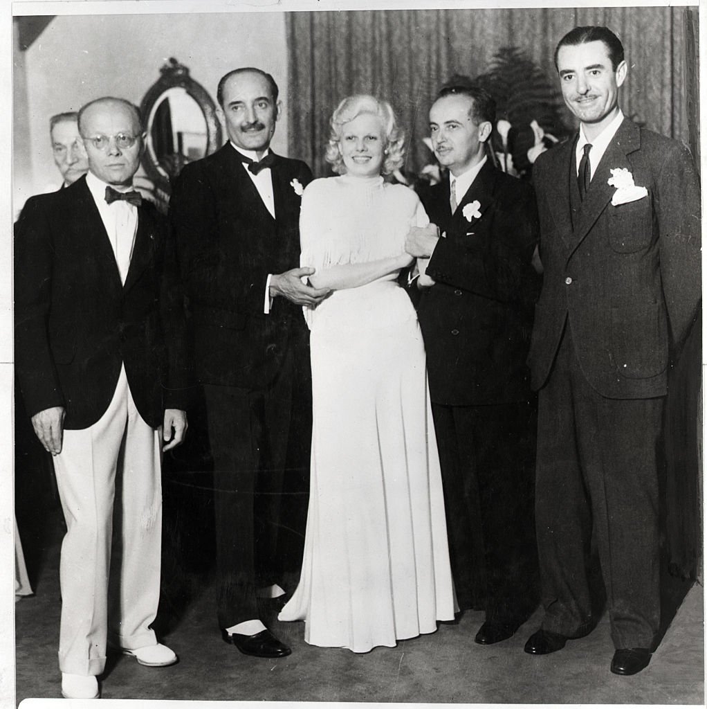 Jean Harlow at marriage to Paul Bern, film executive, 1932 with stepfather Count Bello and best man, John Gilbert. | Source: Getty Images