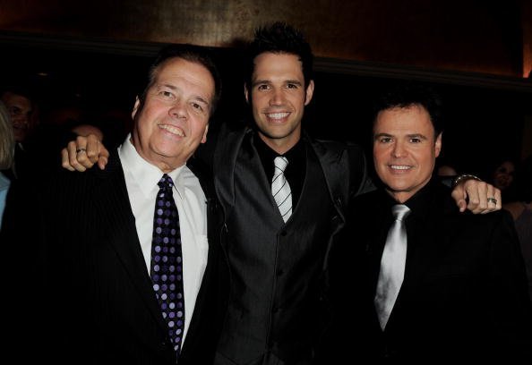 Singers Alan Osmond, his son David Osmond and Alan's brother Donny Osmond arrive at The National Multiple Sclerosis Society's 36th Annual Dinner Of Champions at the Century Plaza Hotel on September 27, 2010, in Los Angeles, California. | Source: Getty Images.