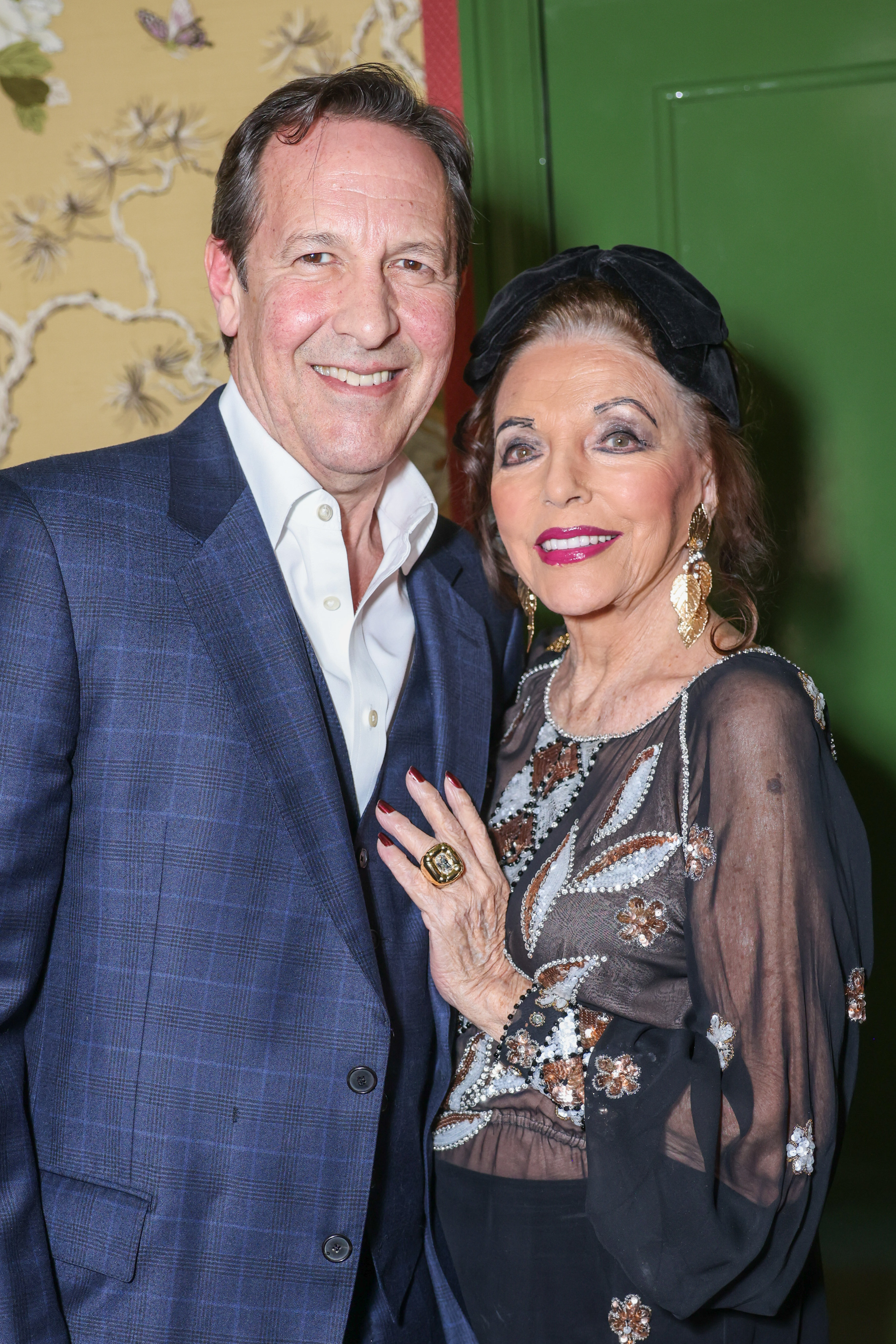 Percy Gibson and Dame Joan Collins at the Broadwick Soho Hotel on April 23, 2024 in London, England | Source: Getty Images