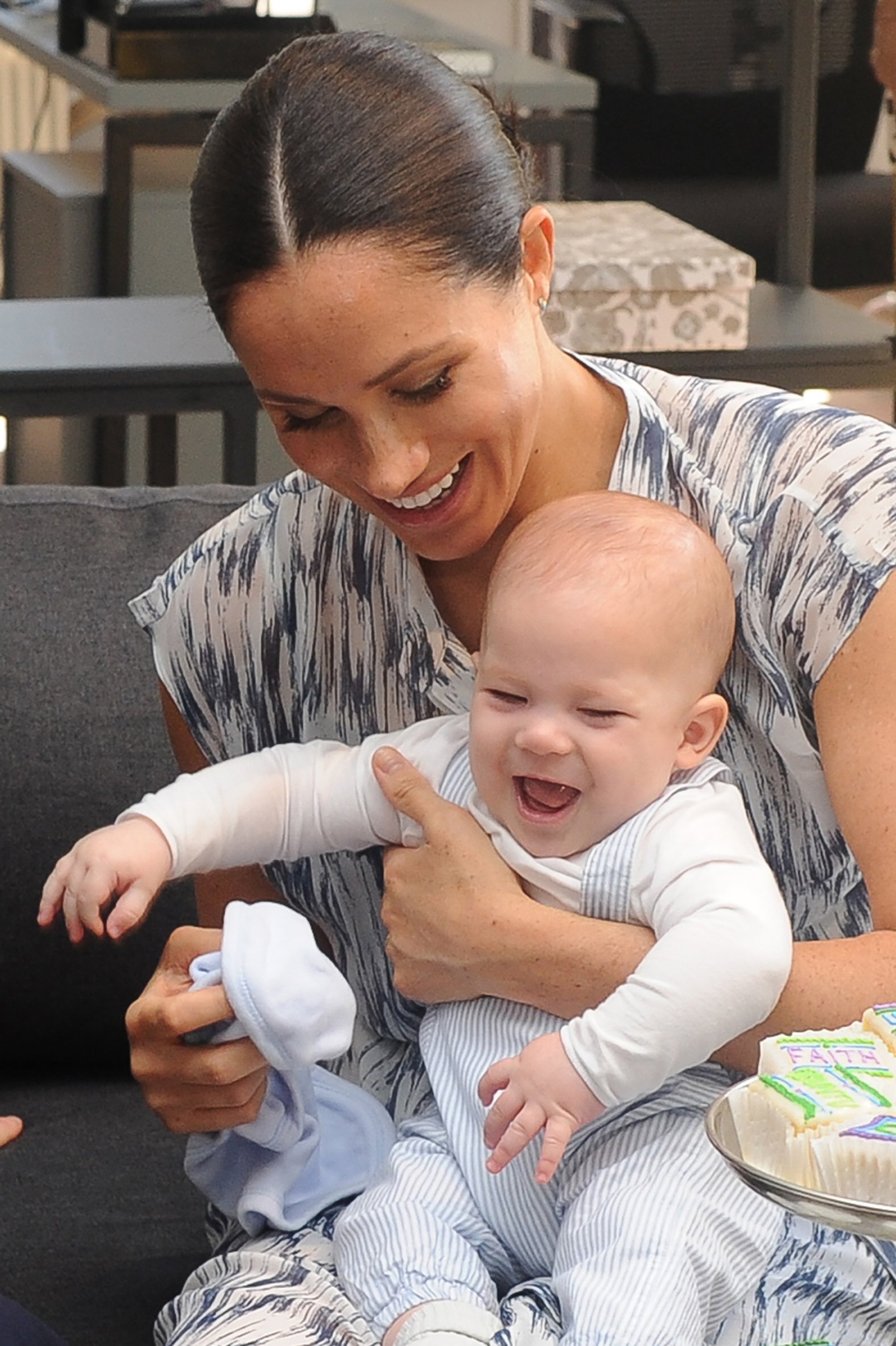 Britain's Duchess of Sussex Meghan hold their baby son Archie as she and the Duke meet with Archbishop Desmond Tutu and his wife (unseen) at the Tutu Legacy Foundation in Cape Town on September 25, 2019 | Source: Getty Images 