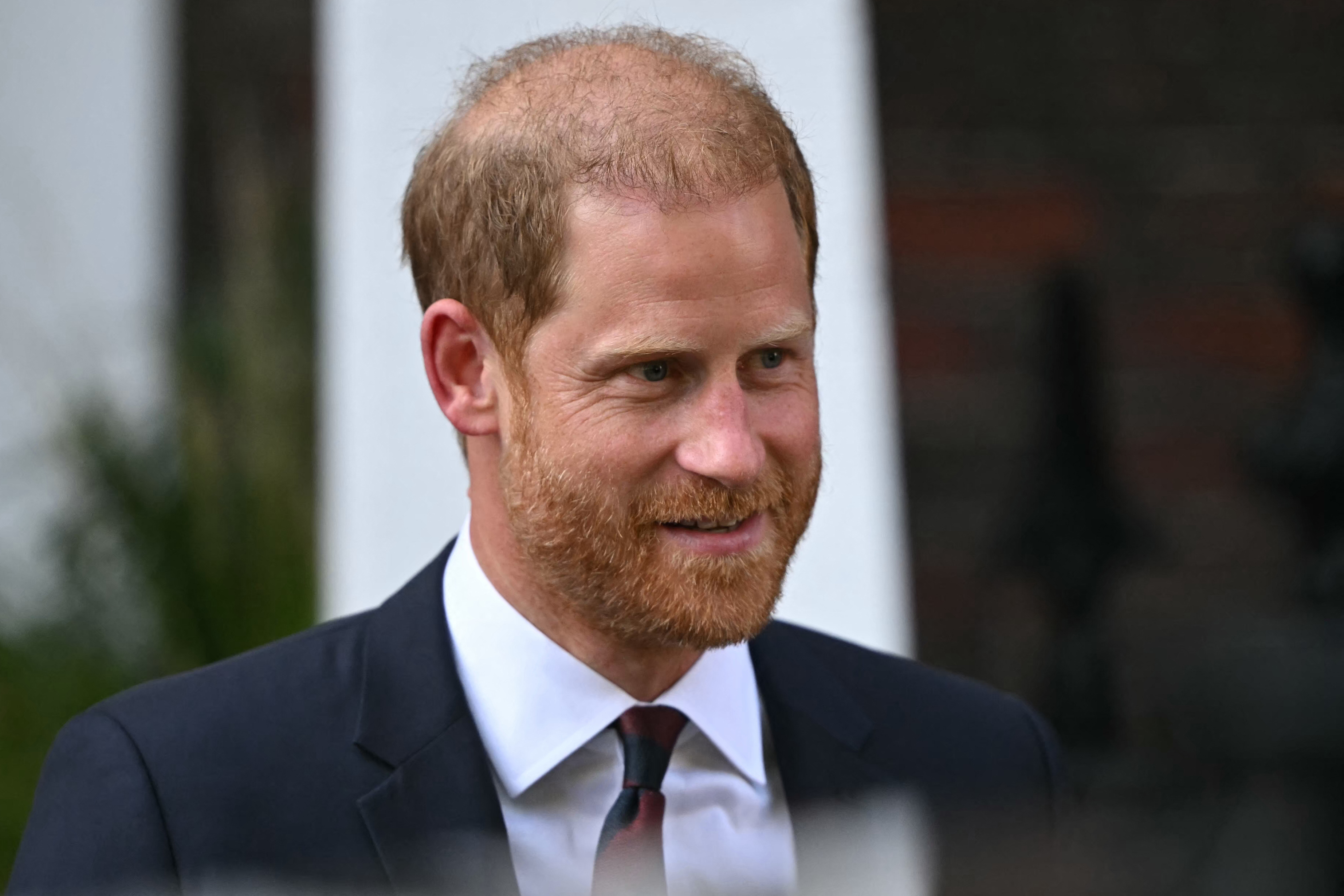 Harry spent time greeting photographers before heading inside the venue. His appearance without Meghan, Duchess of Sussex, drew attention after videos from the event were shared online. | Source: Getty Images